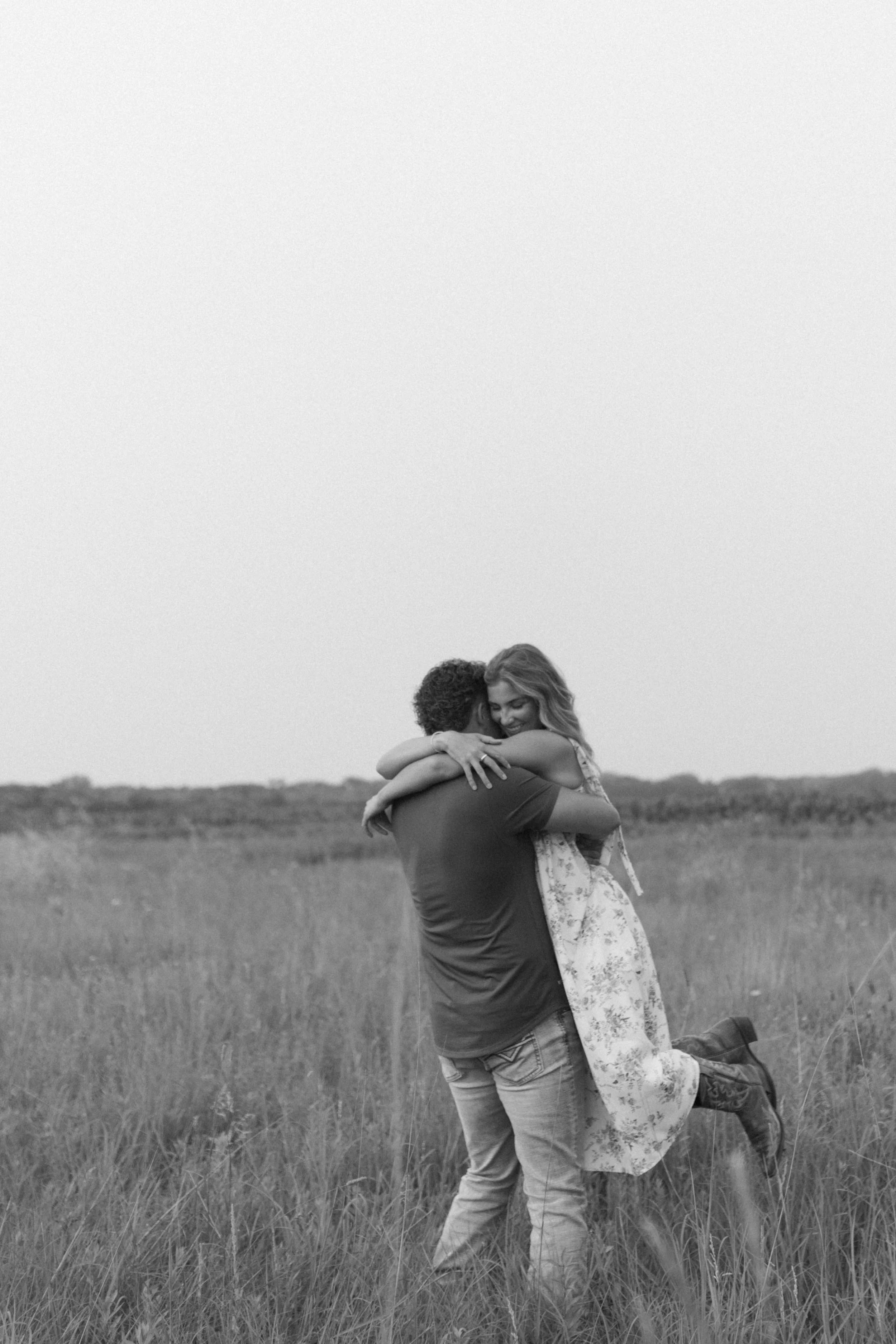 Fargo North Dakota engagement session couple hugging in open field by Aesthete Pix