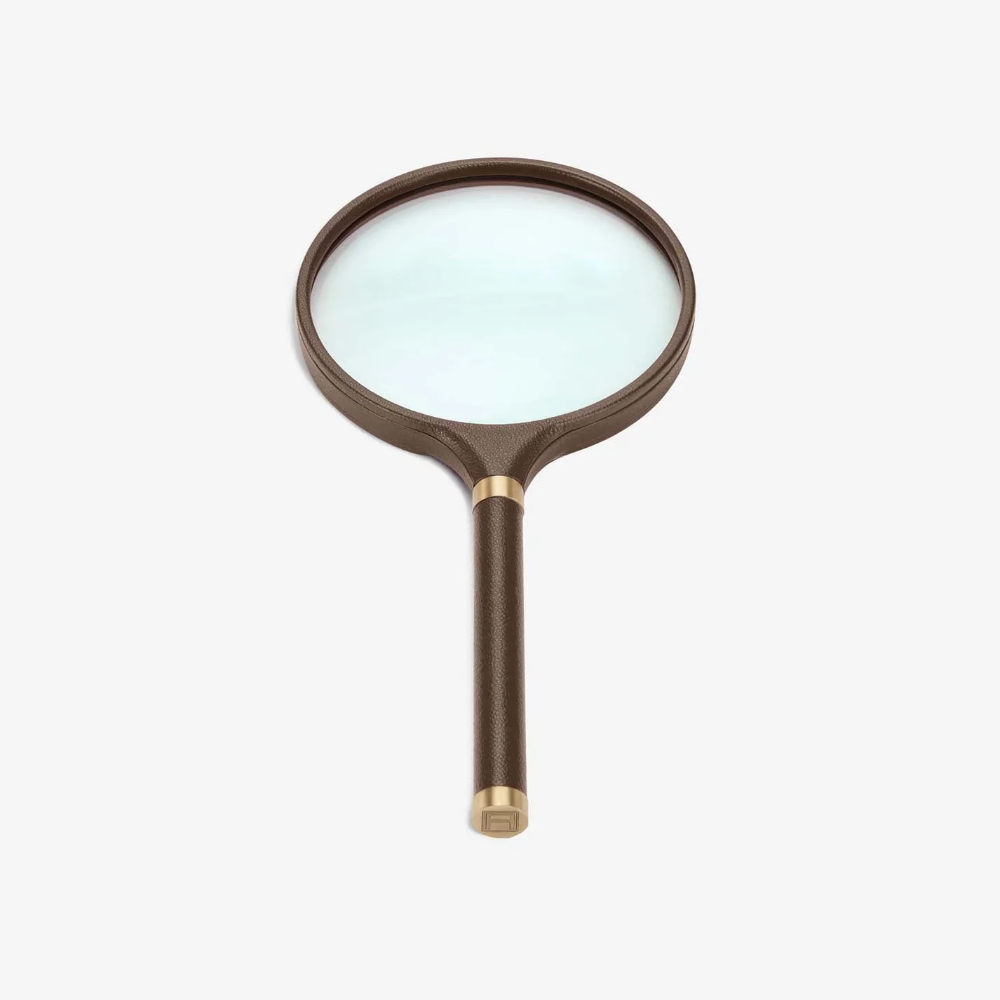LibraryCollection_ArchivalMagnifyingGlass_BrownLeatherBrass_StraightOn_Assouline_2025-1000x1000.png