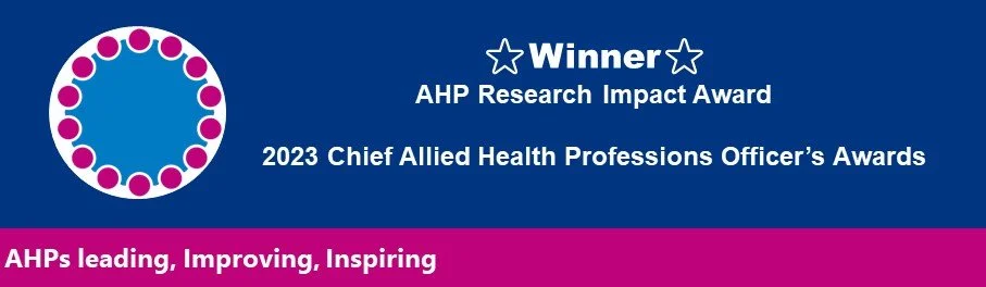 Digital award banner with a blue background, pink and white circular logo on the top left, and white text announcing the winner of the 2023 Chief Allied Health Professions Officer's Awards for AHP Research Impact Award, with a pink bar at the bottom containing a slogan.