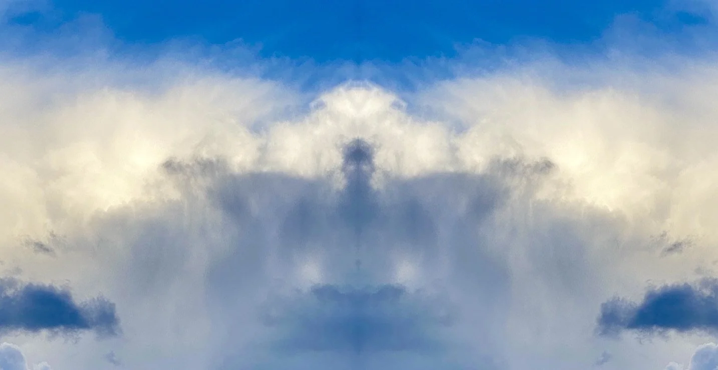 Symmetrical image of a cloudy sky with blue hues