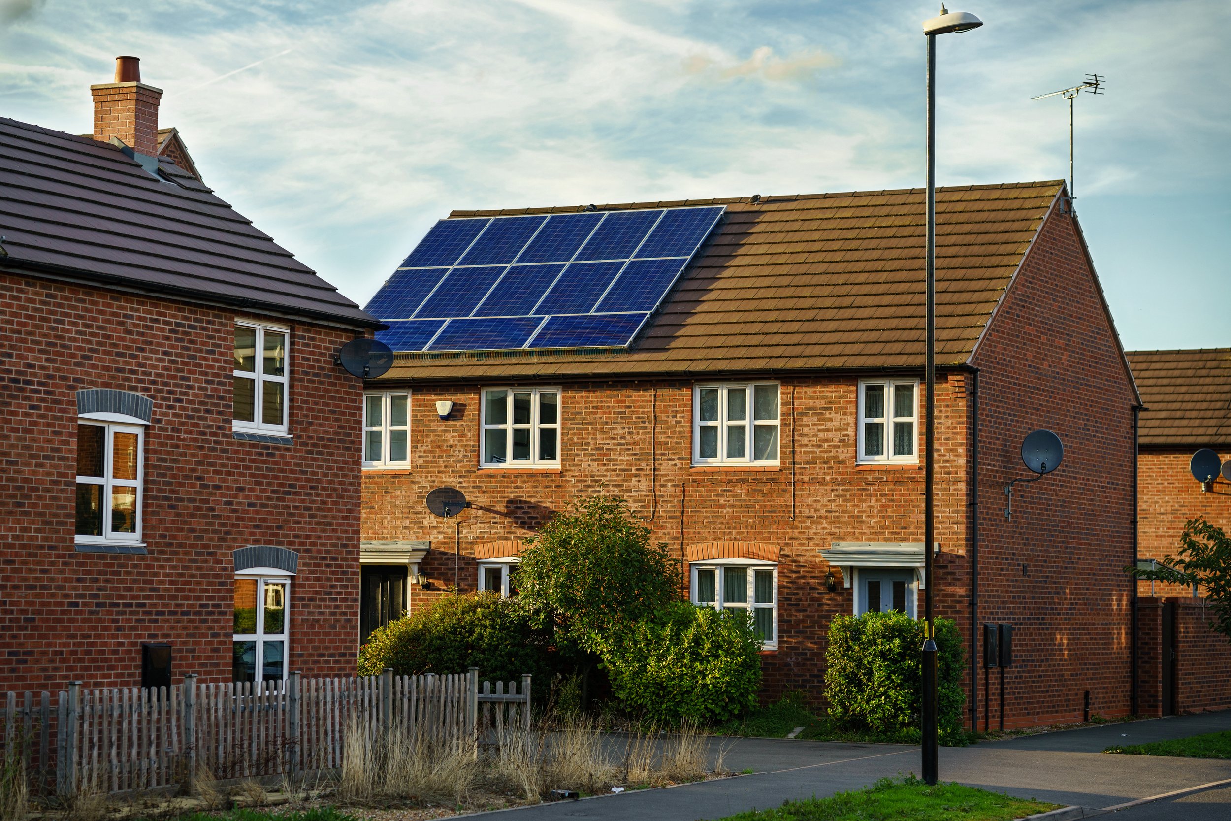 Residential homes with solar panels in a neighbourhood
