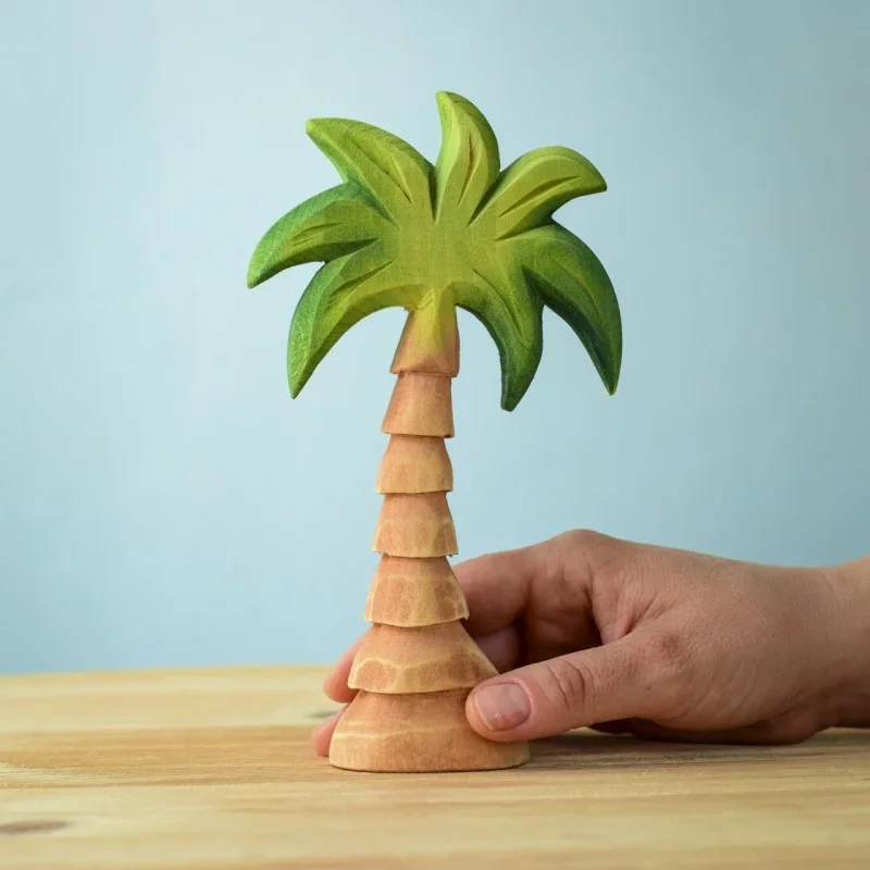 small palm tree treleker bumbu toys with hand.webp
