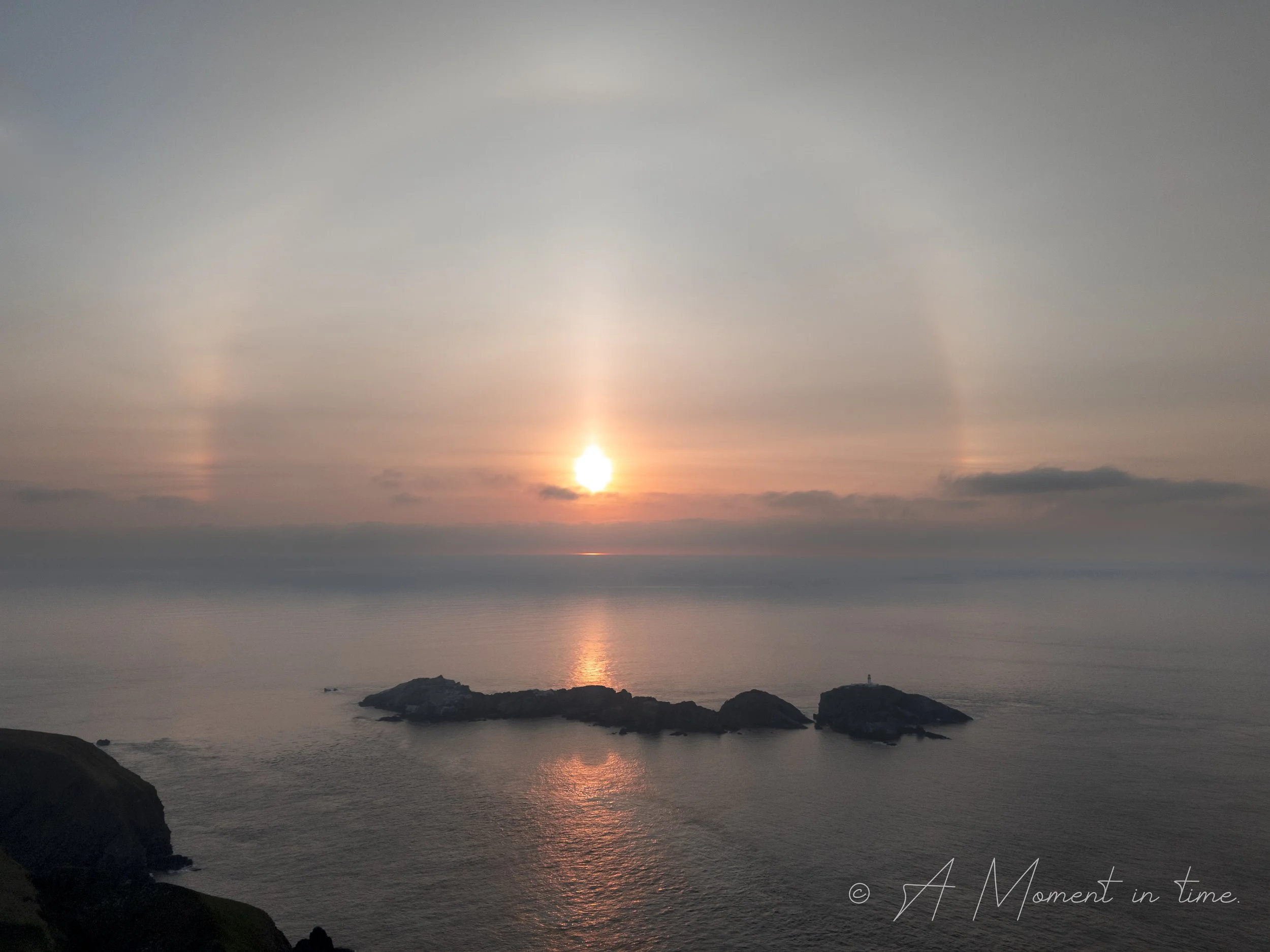 Muckle Flugga Lighthouse. Fog rainbow UK's most northerly point