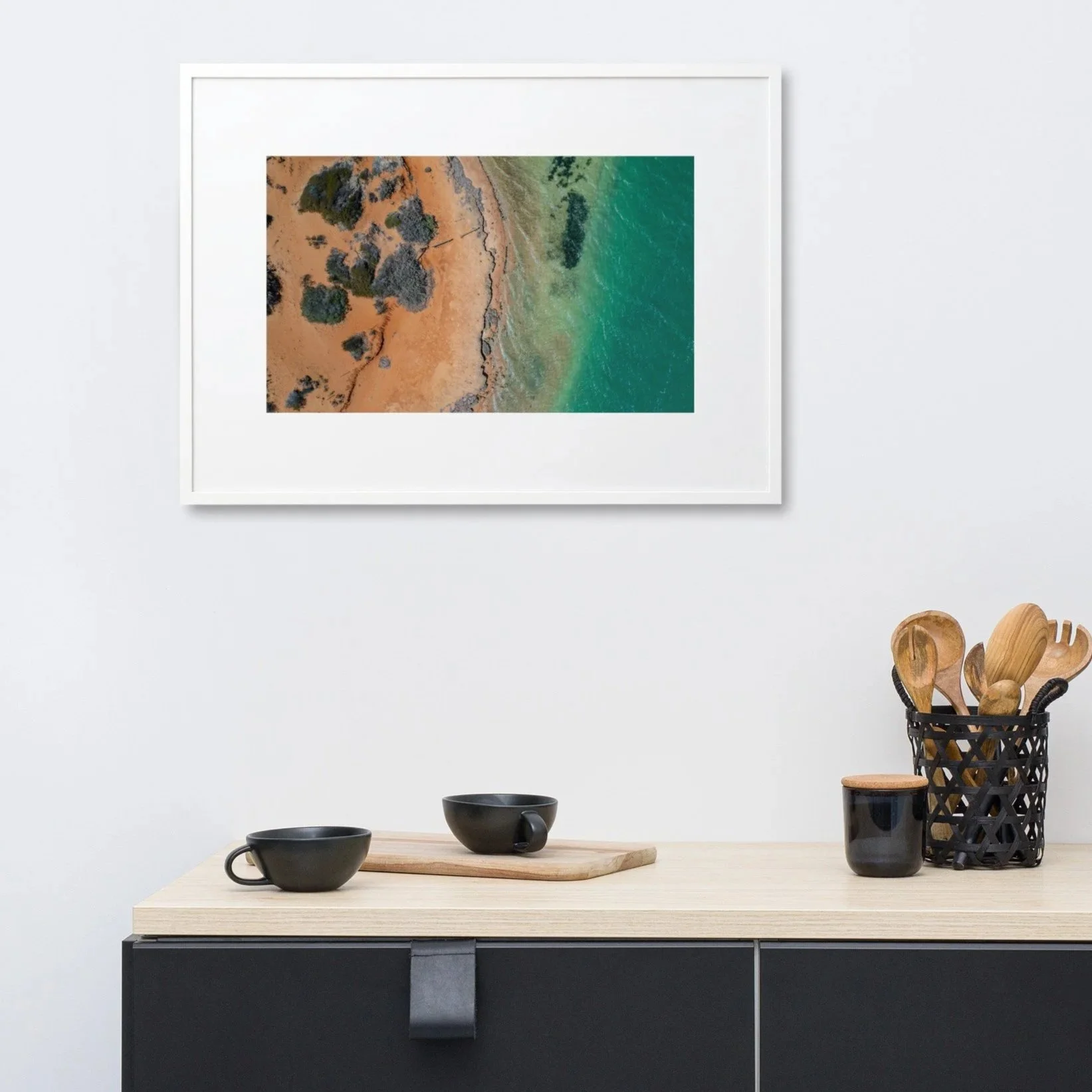 Turquoise divide coastal wall art displayed above buffet cupboard in modern room