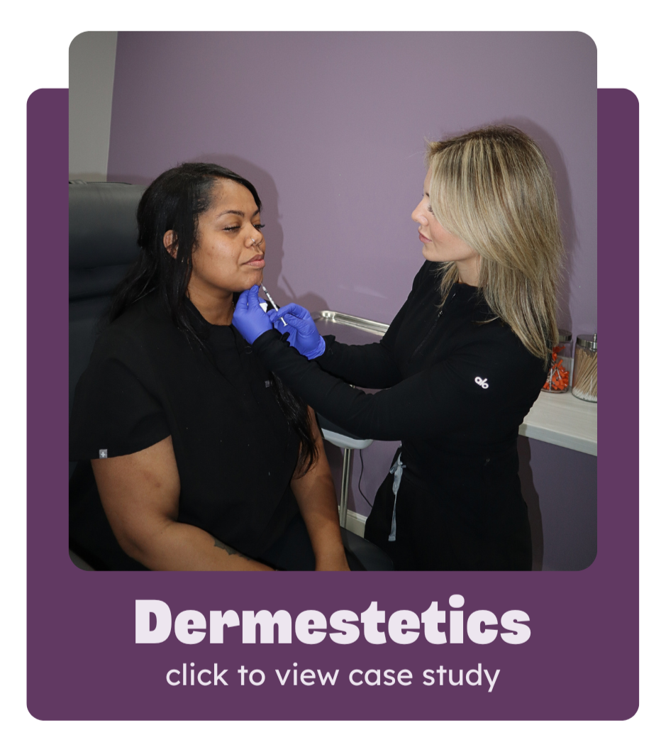 A woman receiving a cosmetic treatment from a professional in a clinic or office setting. The practitioner is wearing gloves and appears to be administering an injection to the woman's face. The background features a purple wall and medical supplies.