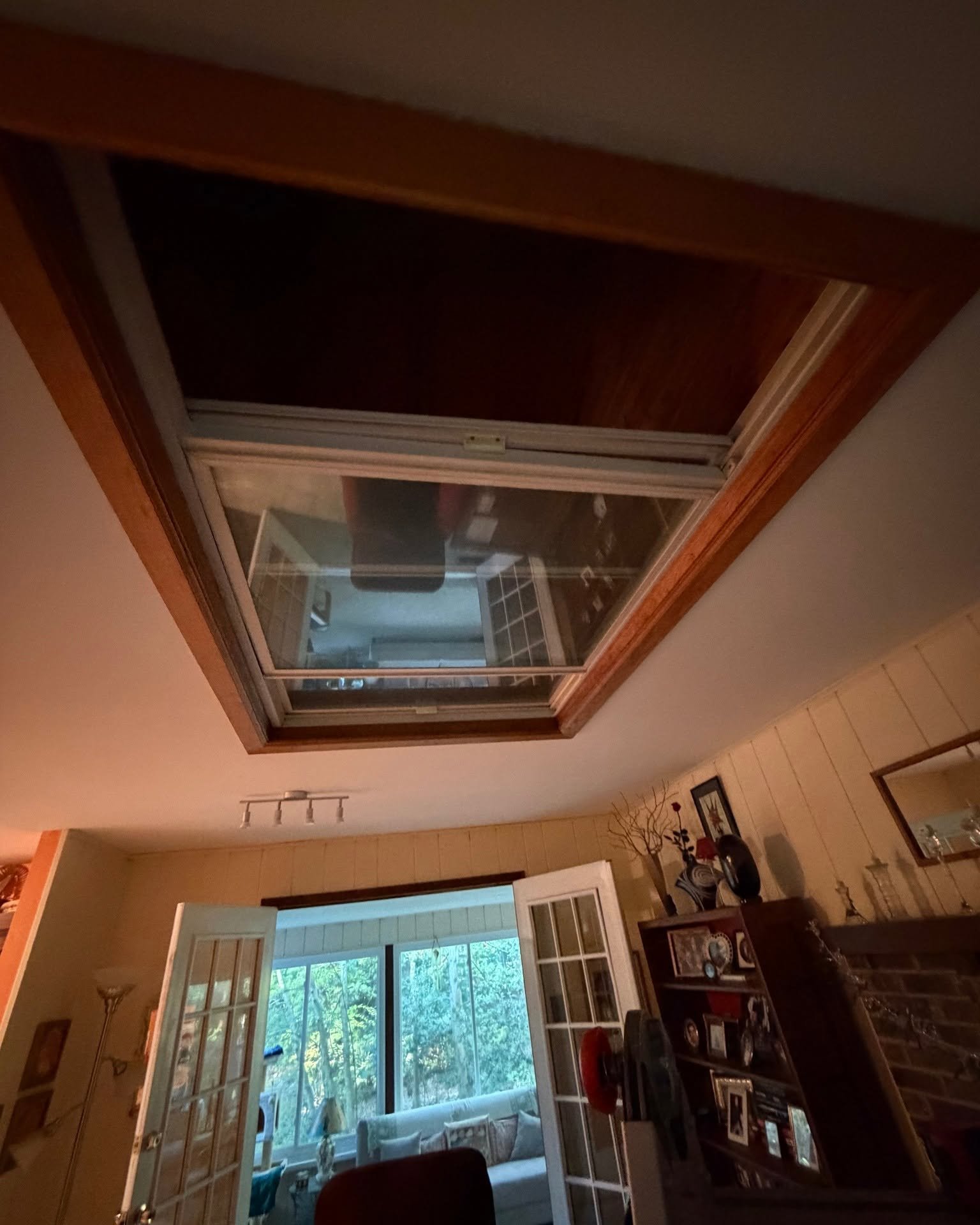 Old mirror covering the closed skylight opening in a Berlin home before restoration