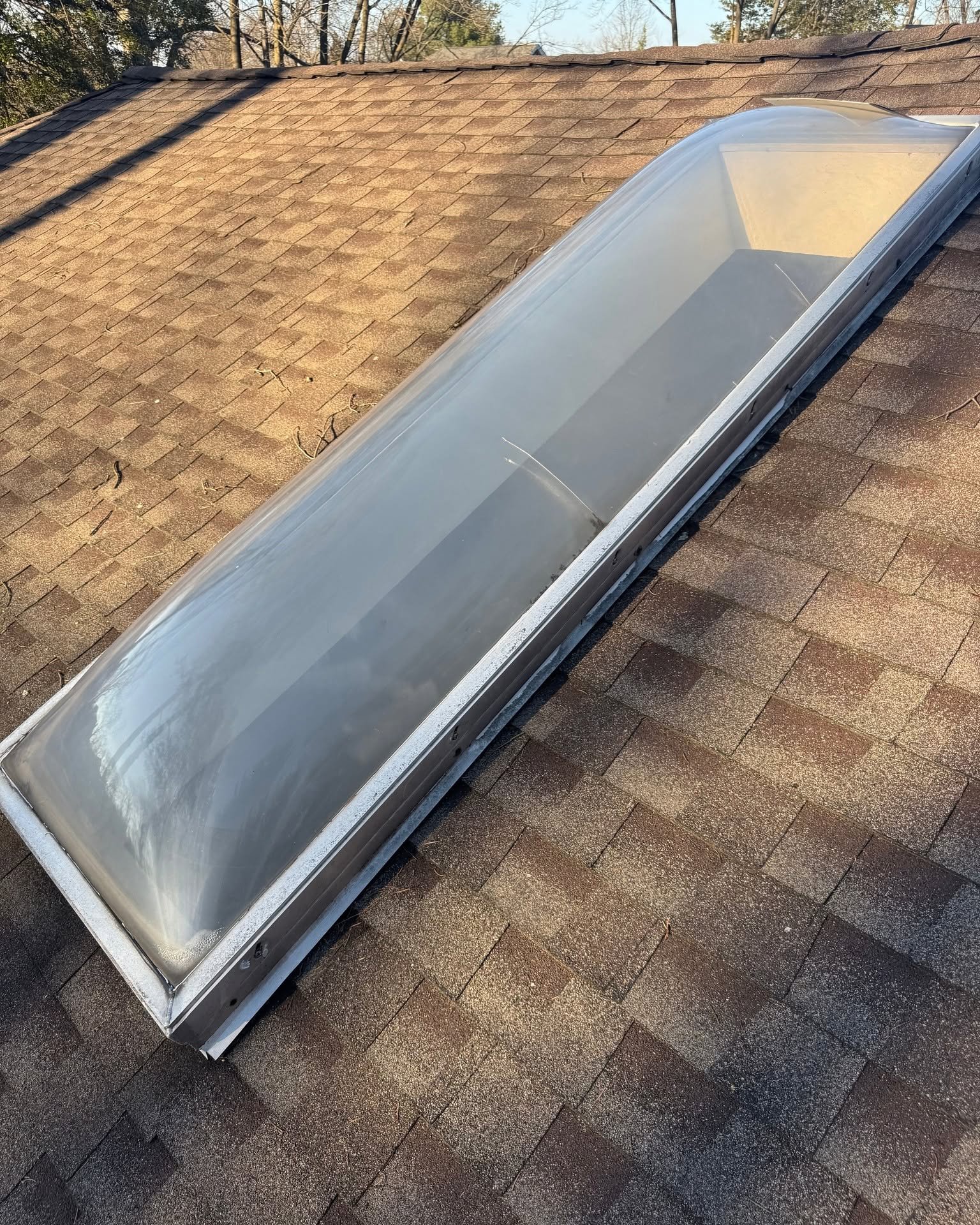 Existing outdated acrylic bubble skylight before replacement by The RCG Group