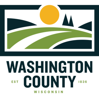 A stylized logo featuring a yellow sun, green rolling hills, and dark blue sky with mountains, indicating Washington County, Wisconsin established in 1836.