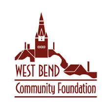 Logo of West Bend Community Foundation with a stylized illustration of a town and a prominent church or clock tower.