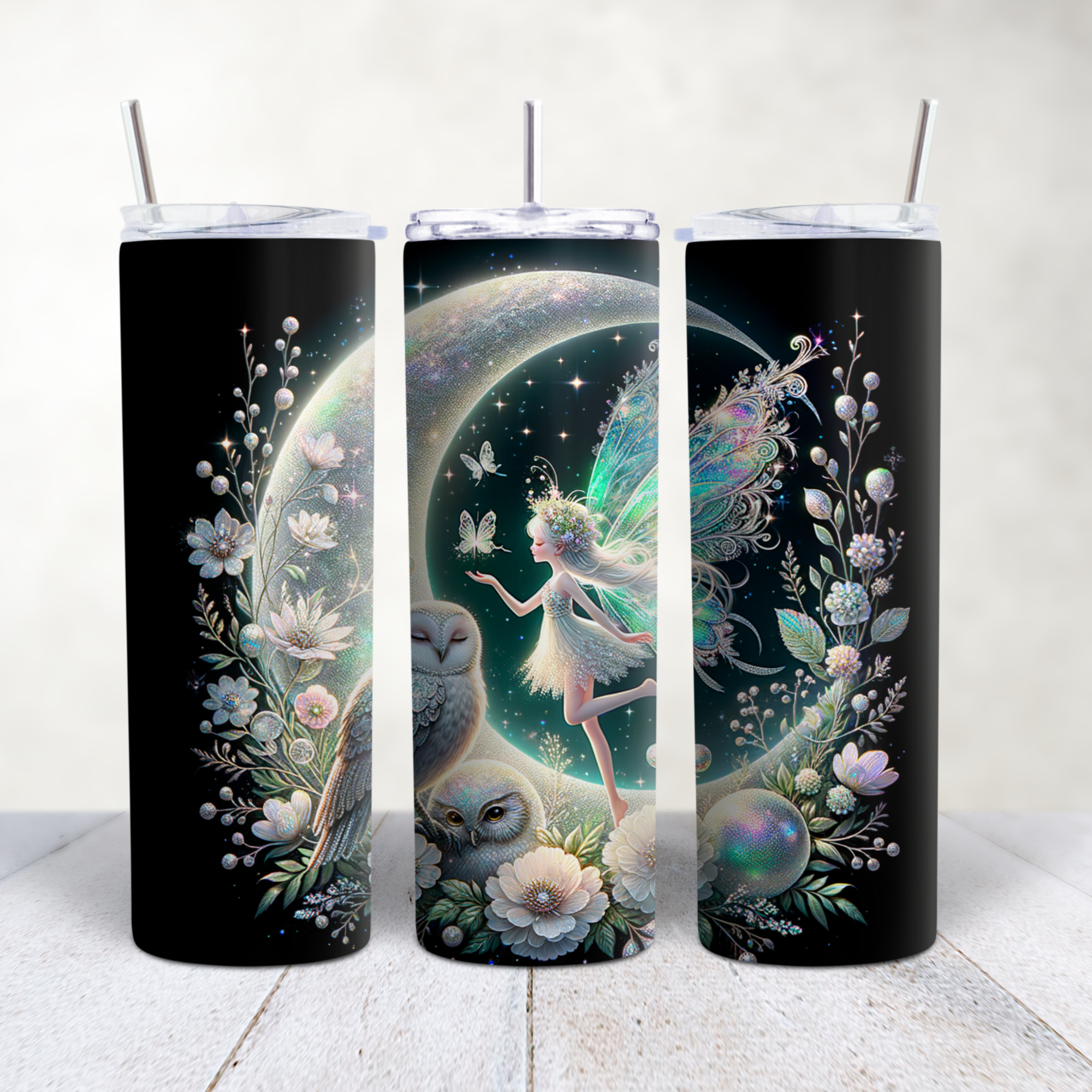 Three black tumbler cups with mystical fantasy artwork featuring a fairy, owls, butterflies, and floral patterns against a cosmic background.