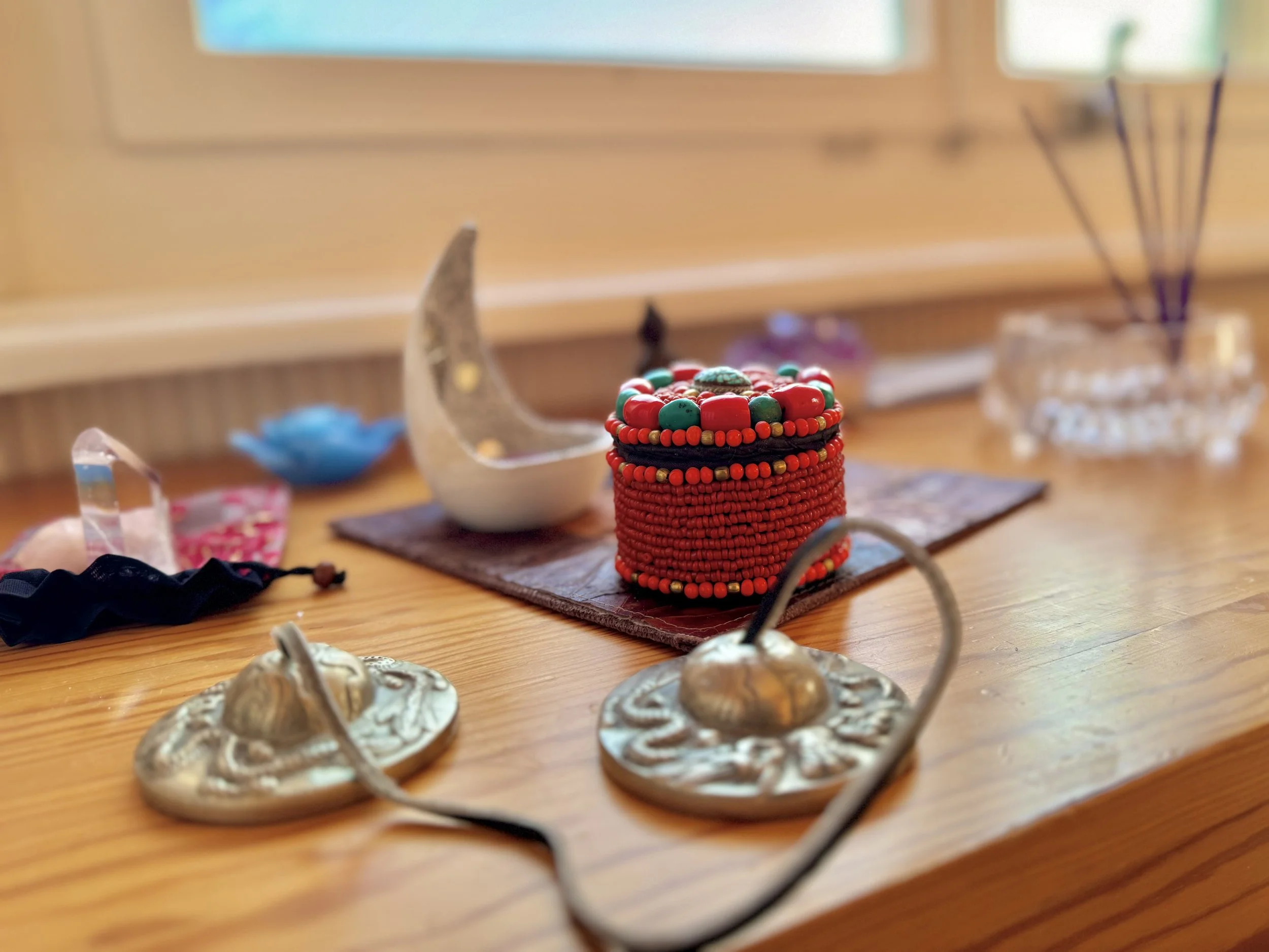 Buddhist ritual supplies on a wooden table