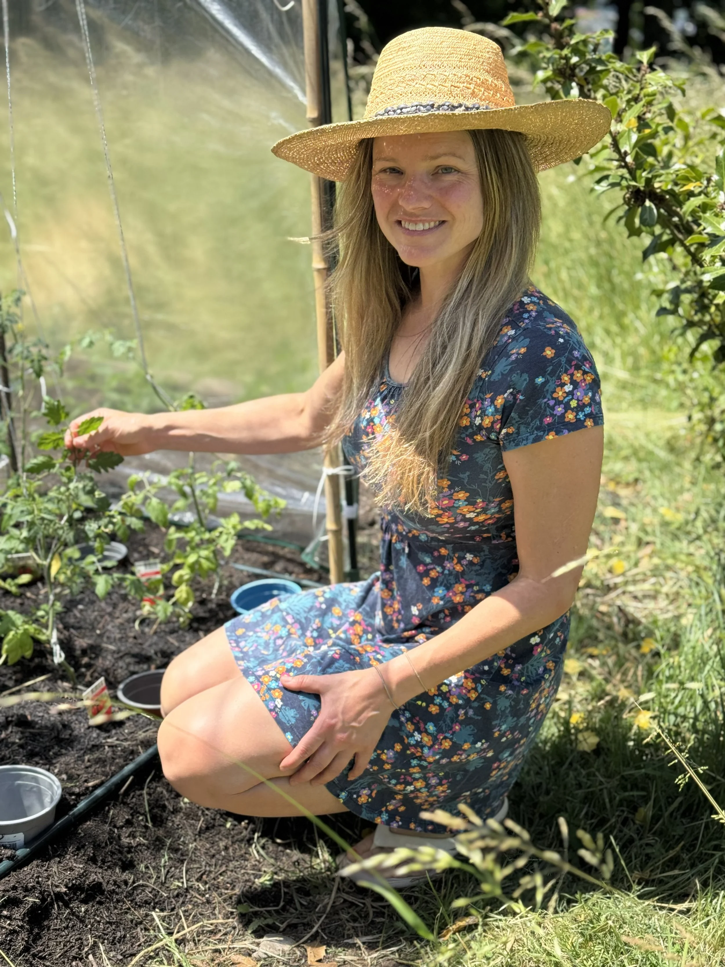 Christine from the UK tending to her “babies”. Somewhere along the way, those little tomato plants soon won her heart.