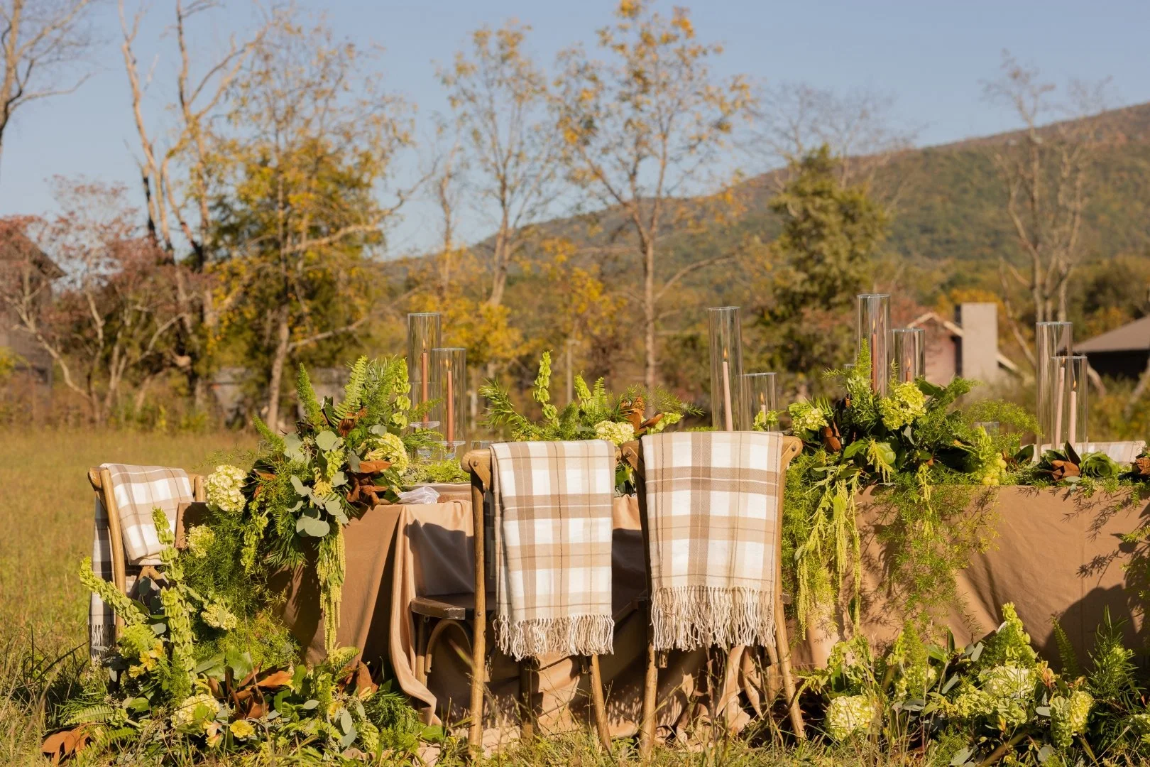 Outdoor fall tablescape at The Lumigail with greenery florals and mountain views.