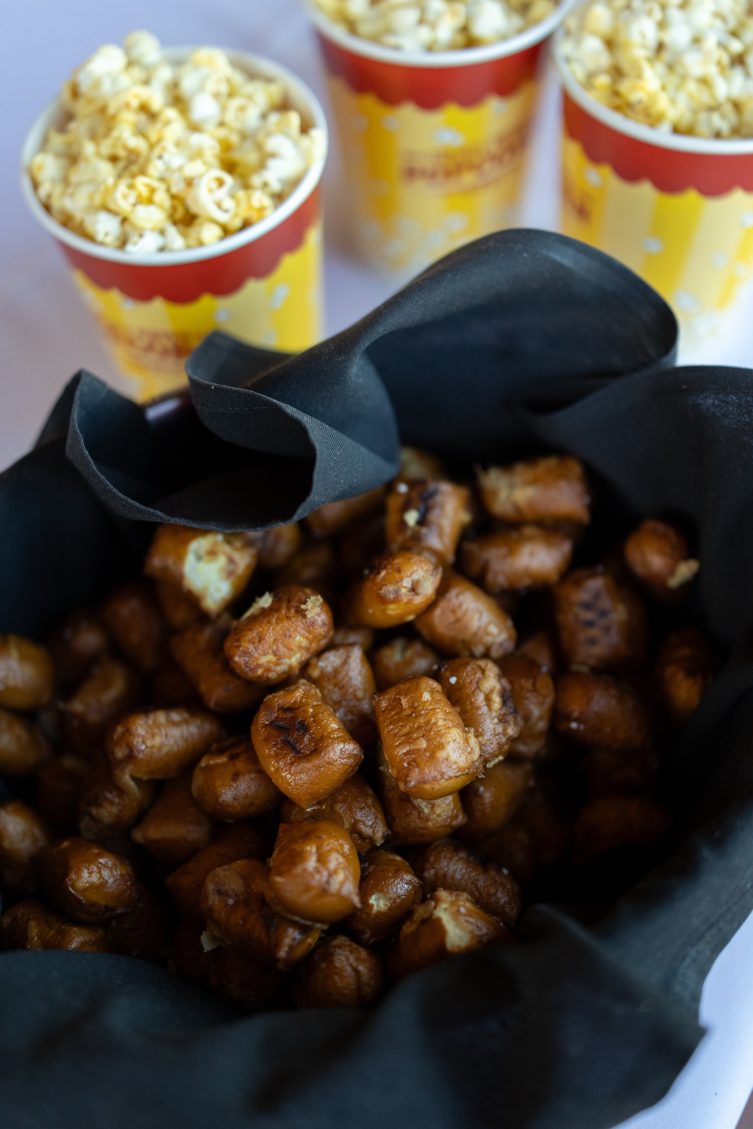 Soft pretzel bites and popcorn served as late night wedding snacks at The Lumigail.