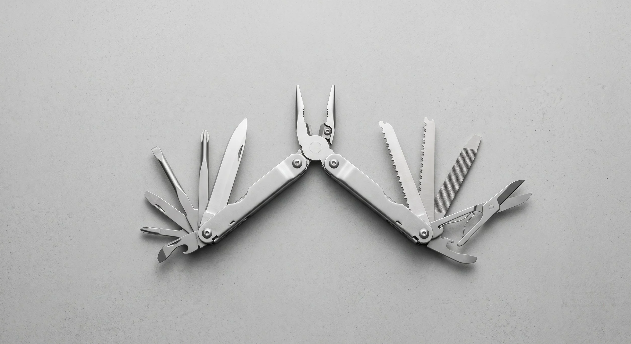An open multi-tool with several implements, a metaphor for one plasma device with several uses.