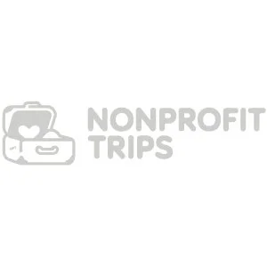 Logo of a suitcase with a heart and a camera, with the text 'Nonprofit Trips'.
