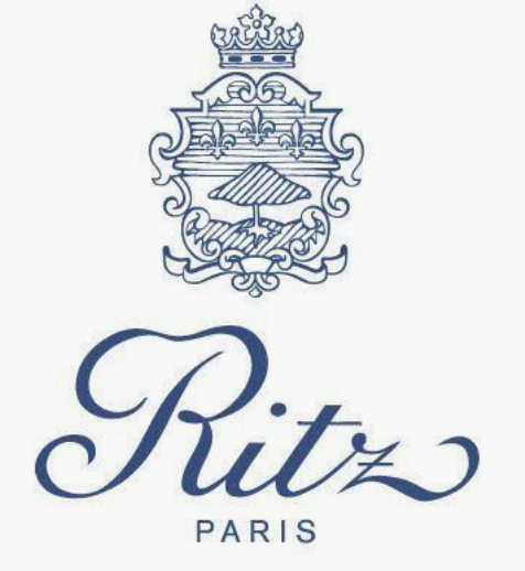 A logo with a crown and ornate crest at the top, above the stylized text 'Ritz PARIS'.