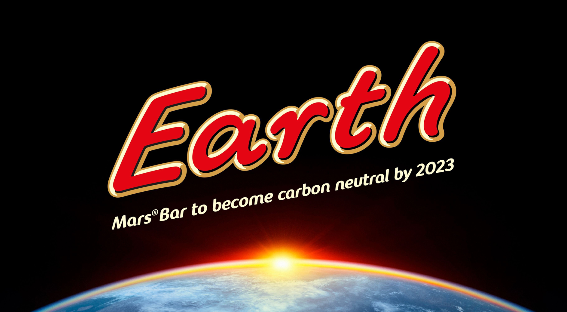 Title screen with the word 'Earth' in bold red letters and a subtitle 'Mars® Bar to become carbon neutral by 2023' over an image of the Earth with the sun rising behind it.