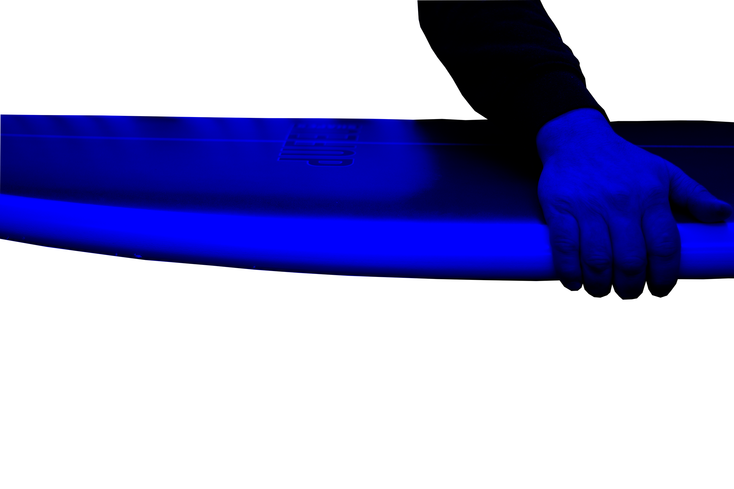 A hand gripping the edge of a surfboard.