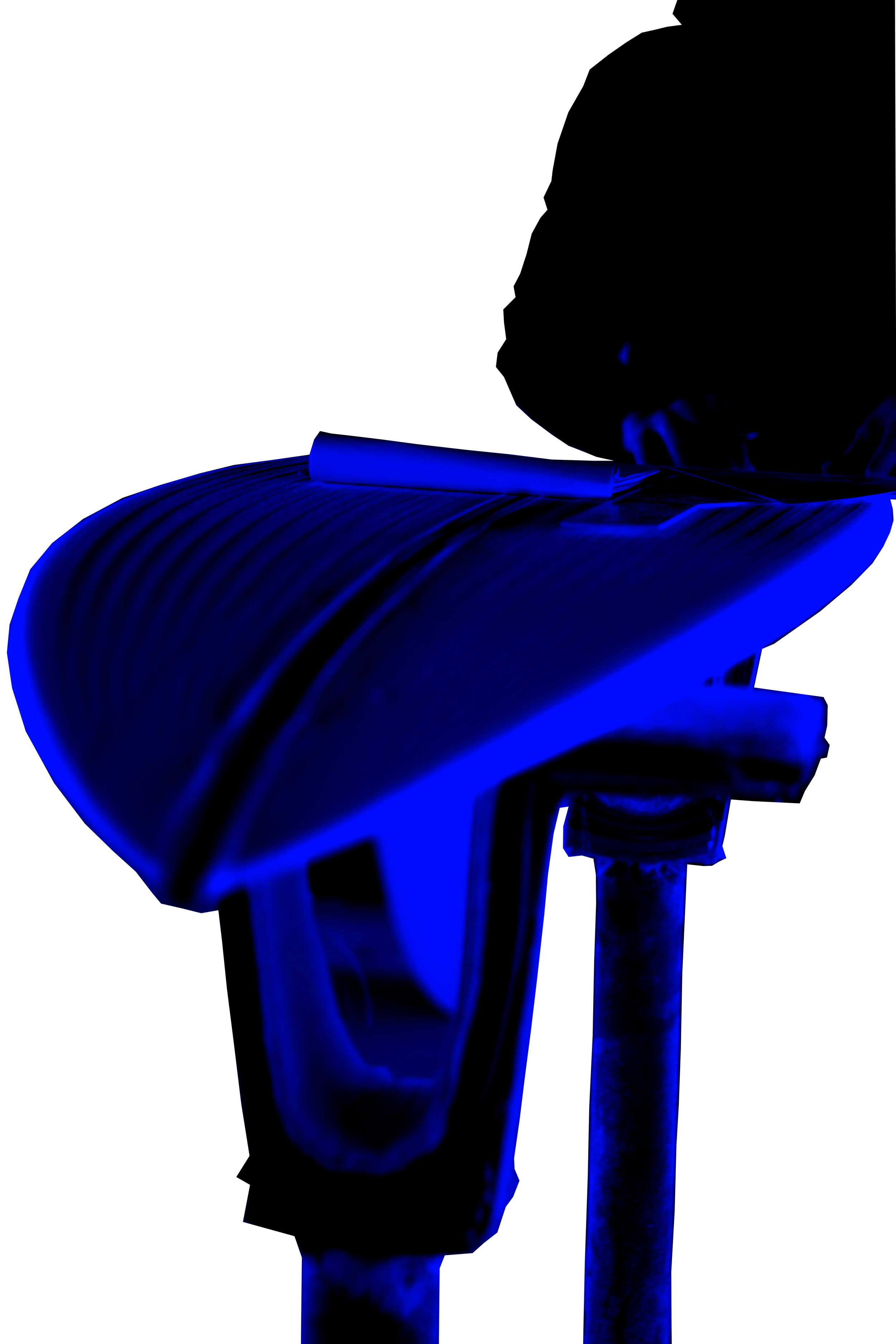 Close-up of a person making a surfboard on a table, illuminated in blue light, in a dark environment.