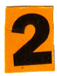 Sign with a large black number 2 on an orange background.