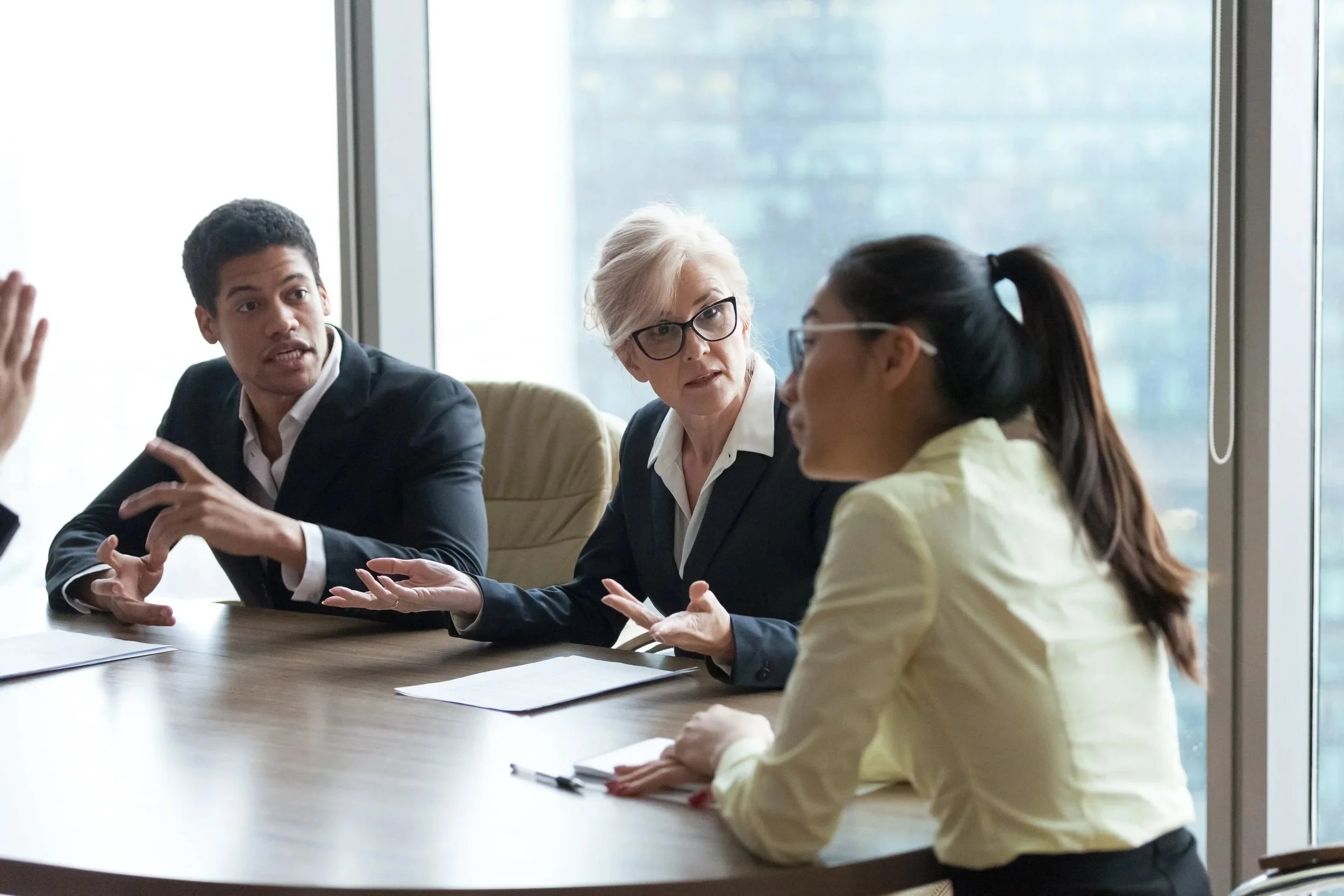 People having a discussion in a corporate meeting room