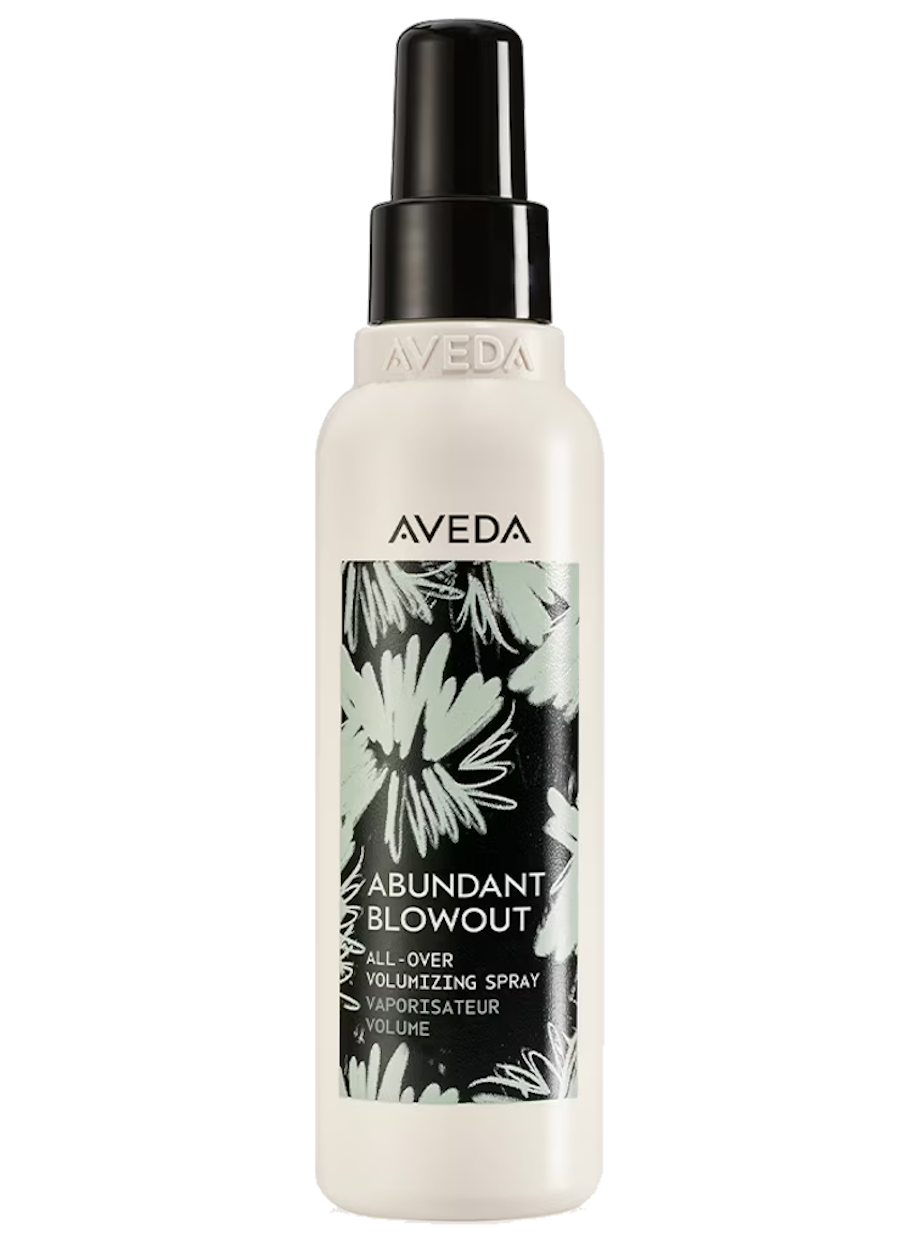 A white spray bottle with a black cap and pump, labeled 'Aveda Abundant Blowout All-Over Volumizing Spray' with floral graphic design.