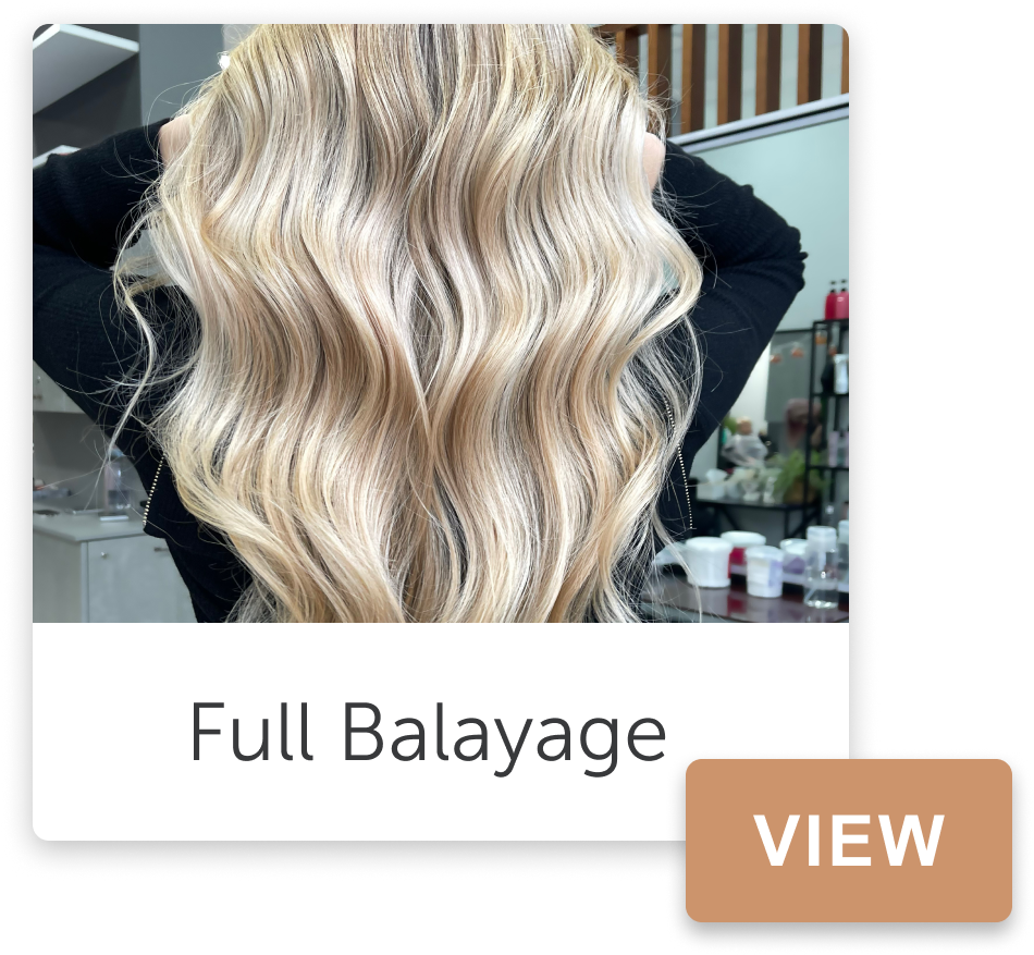 Blonde wavy hair styled during a full balayage treatment at a salon.