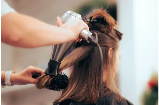 Close-up of glossy, straightened hair showing results of keratin smoothing treatment