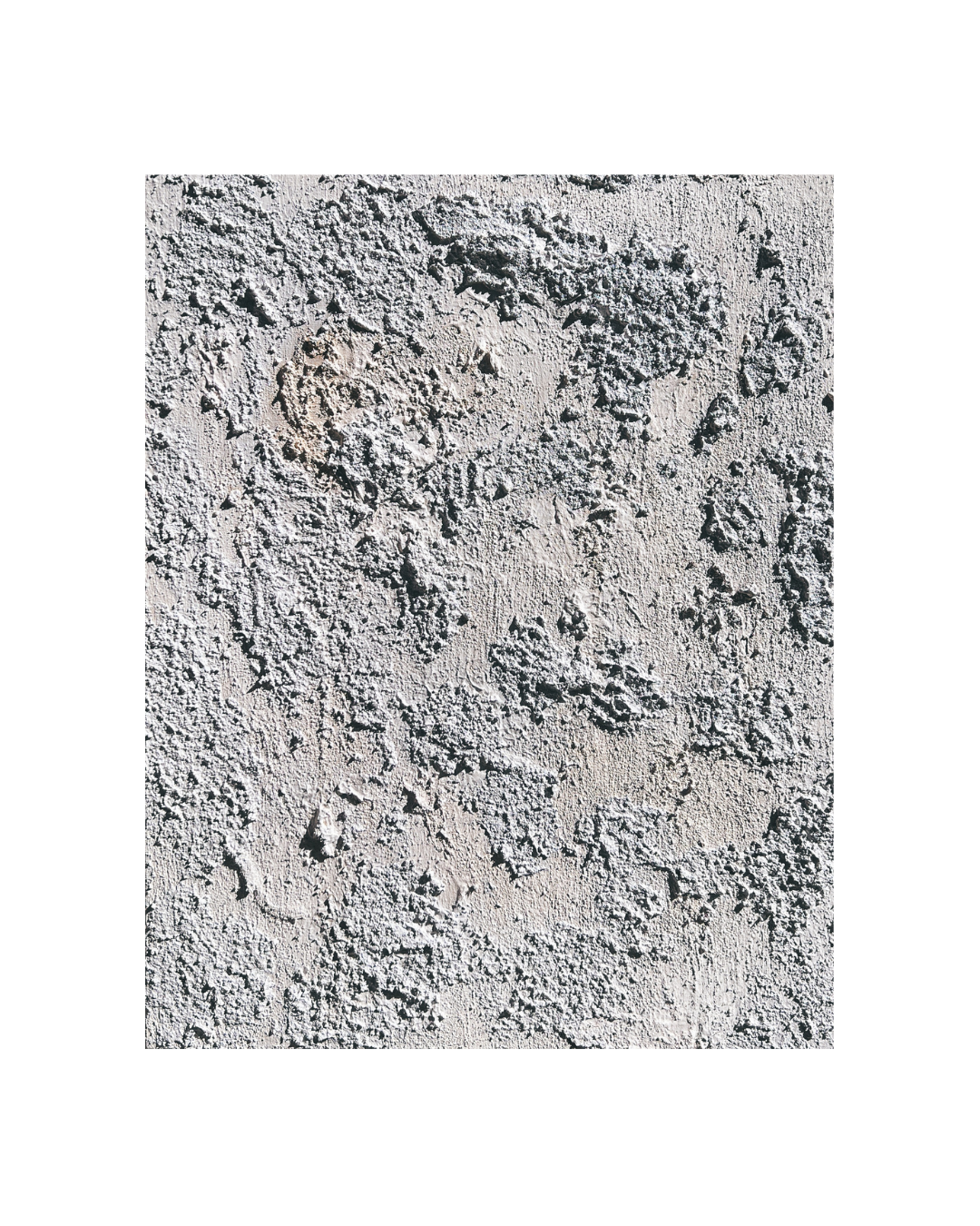Close-up of white, grey, and tea-stained textured artwork made of concrete and sand