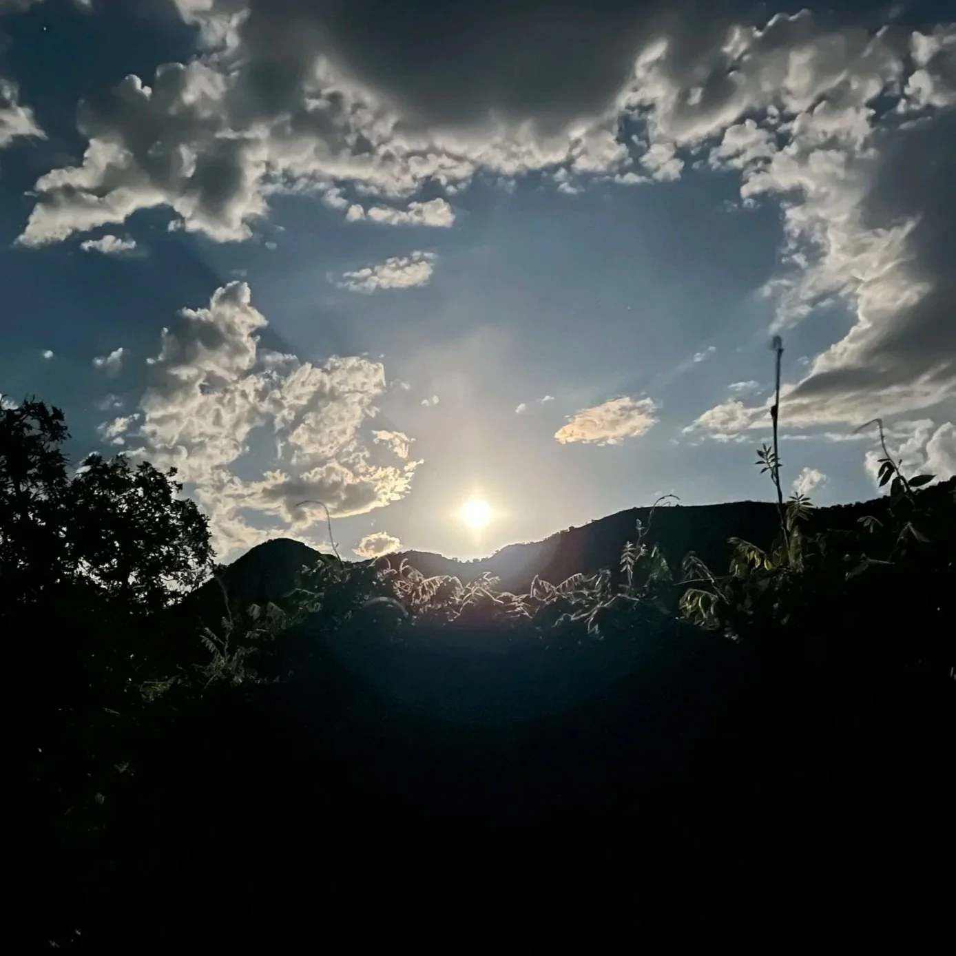 Sun shining through clouds.