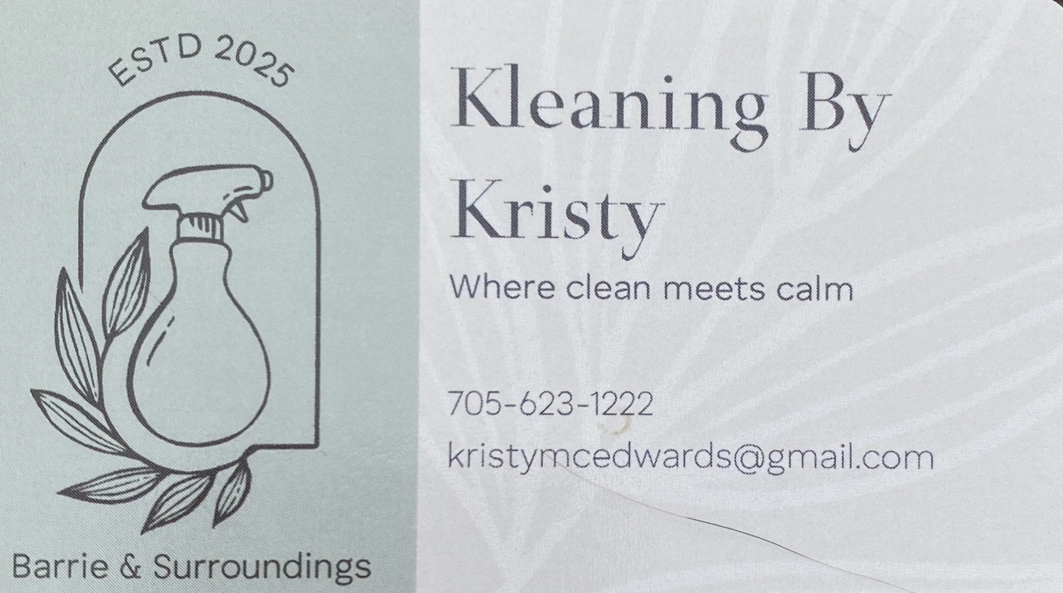 Business card for Kleaning By Kristy, a cleaning service, includes logo with spray bottle illustration, tagline 'Where clean meets calm', and contact information with phone number 705-623-1222 and email kristymcedwards@gmail.com.