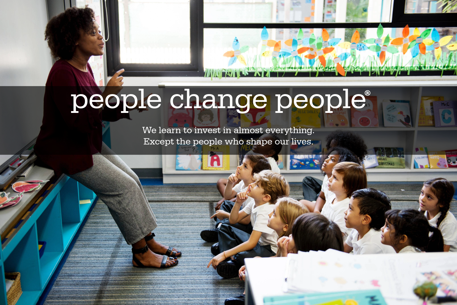 Teacher engaging with students in a classroom, illustrating how people and relationships help shape our lives.