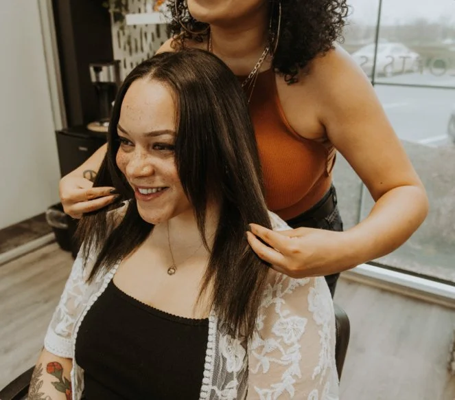 A photo of Ya Girl with the Curl giving a client a consulttion