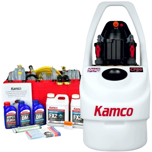 A Kamco cleaning system with various cleaning products on a gray surface and a white, gray, and black cleaning machine with a large handle.