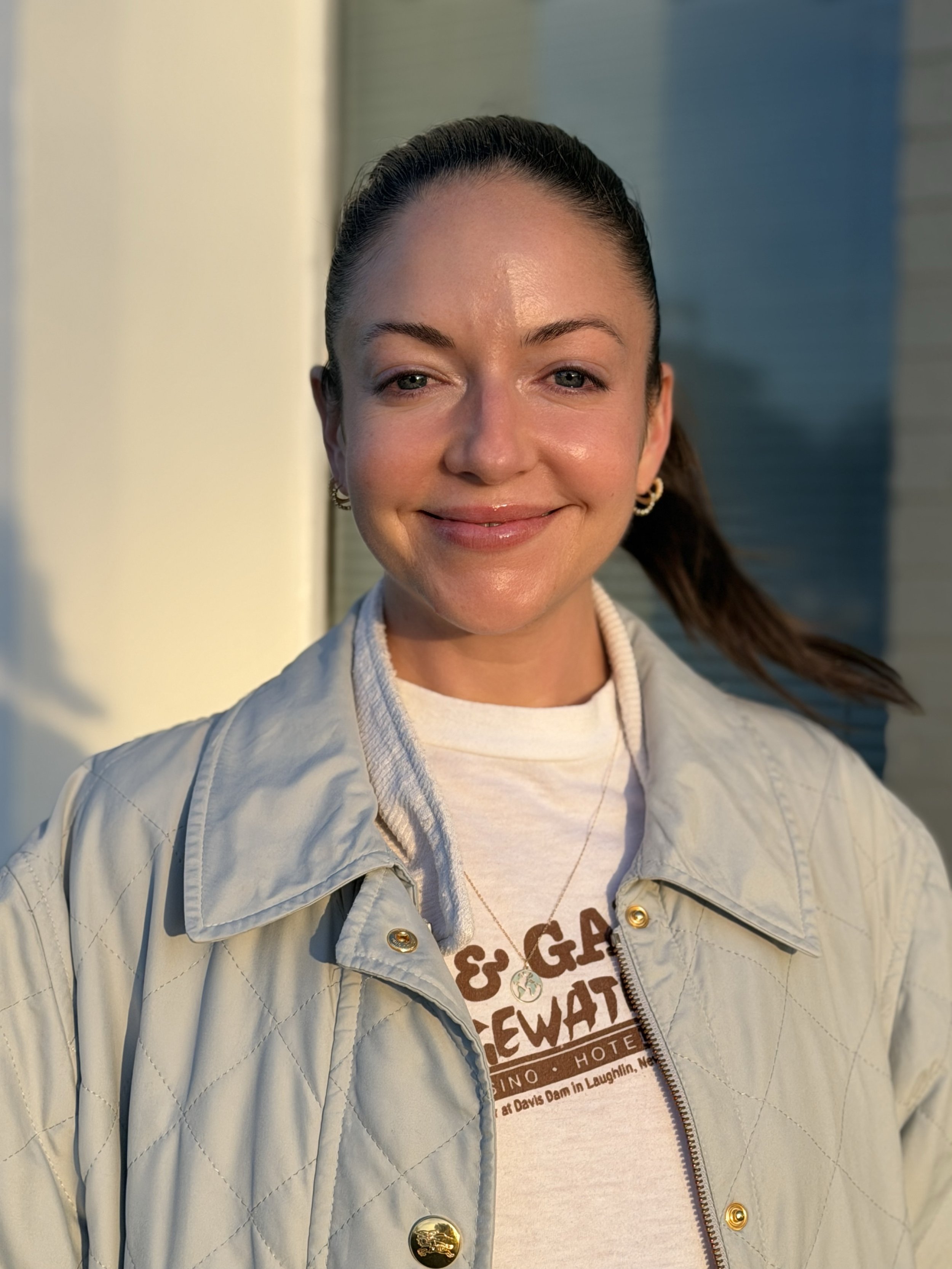 Priscilla Zorrilla holistic coach close-up portrait in golden light, embodying presence and deep care