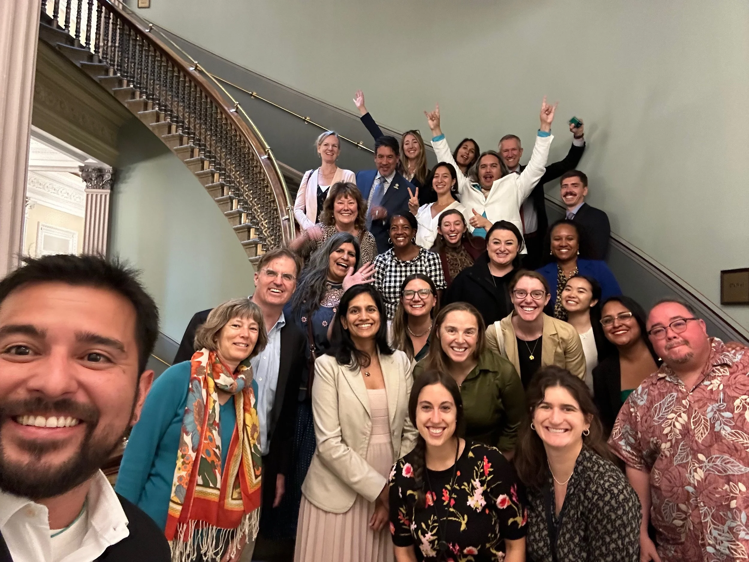Group of people meeting joyfully at The White House to help protect nature for communities experiencing the consequences of nature loss.