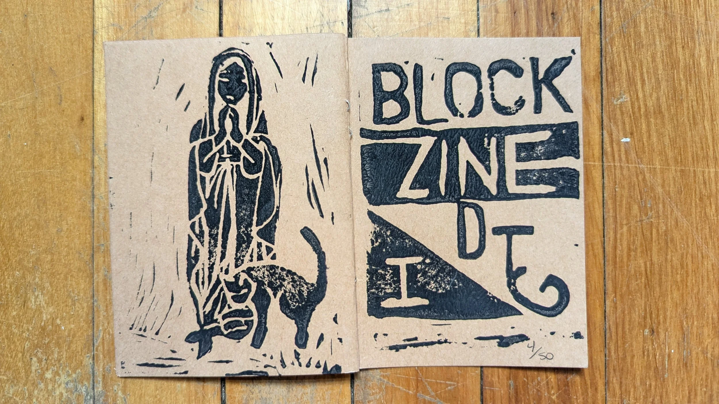 The Mary statue from in front of the basilica, with Simba, and cover art 