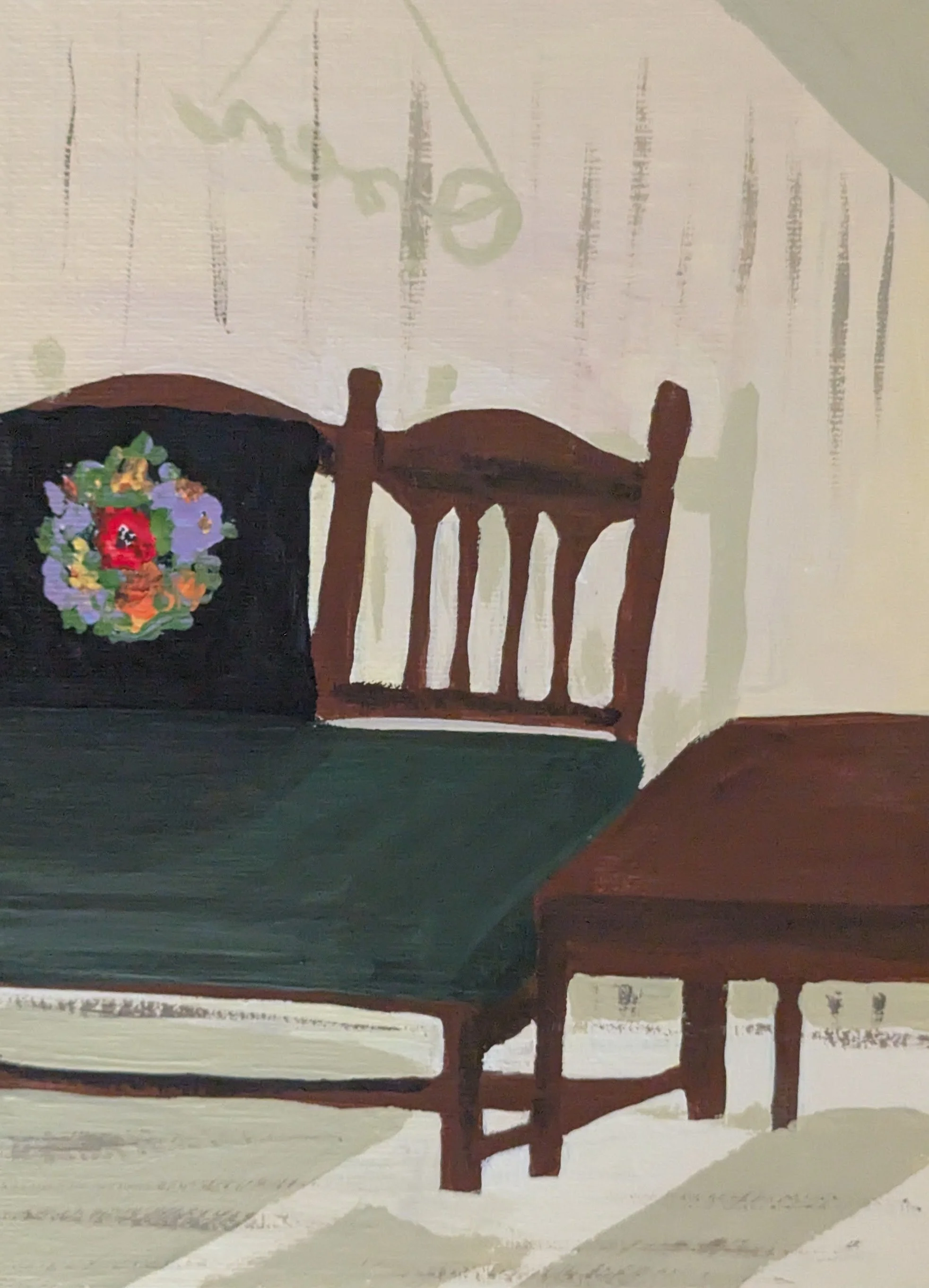 bench at the common with embroidered pillow