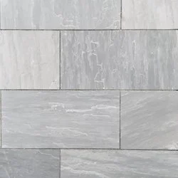 Close-up of gray stone tiles with a textured surface and subtle variations in shading.