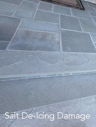 Close-up of a concrete sidewalk with salt de-icing damage, showing surface erosion and discoloration.
