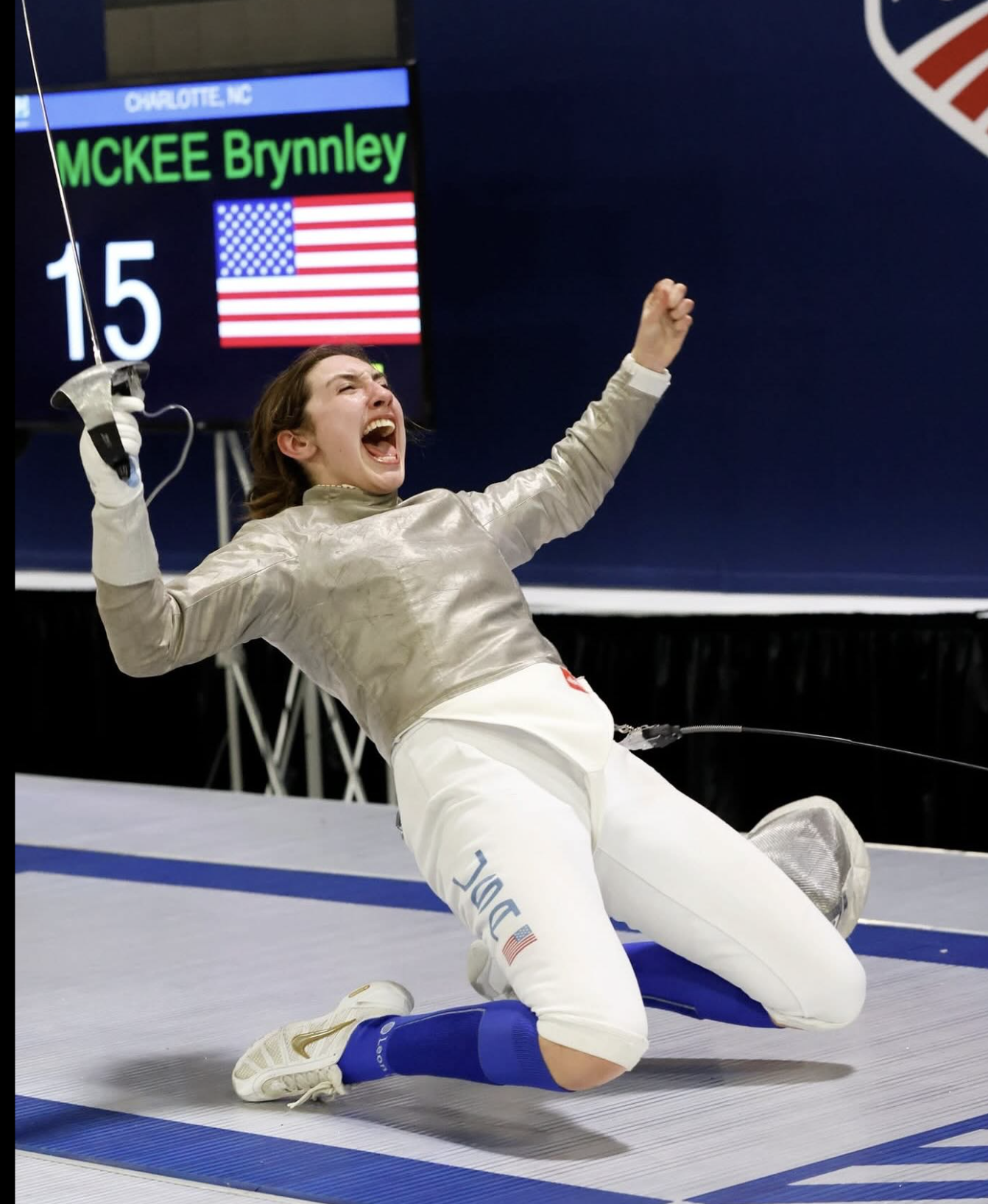 Champion fencer celebrating