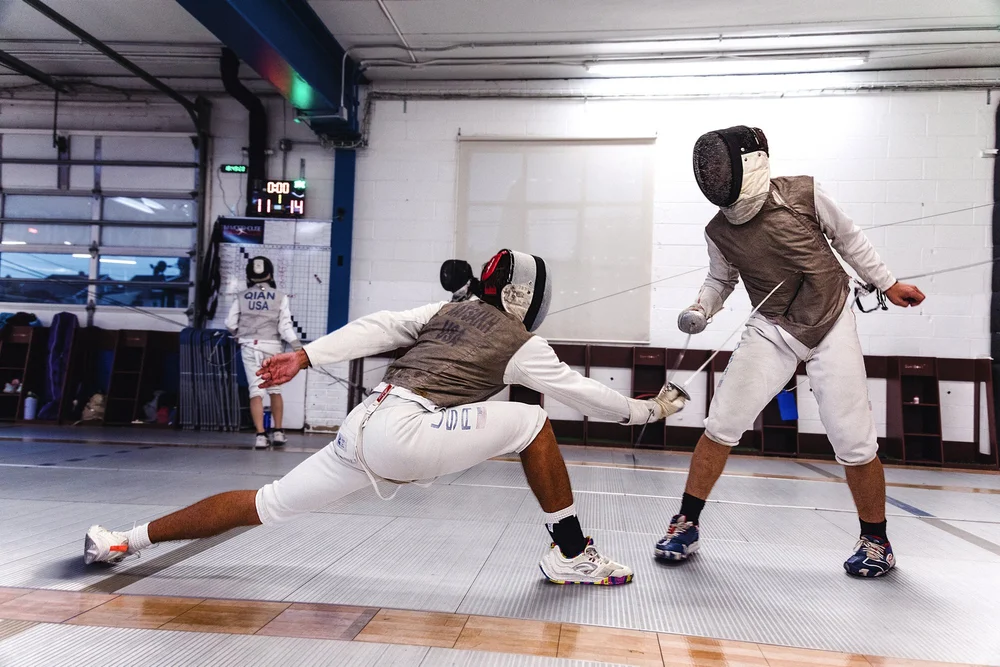 Young fencers bouting at Tim Morehouse Fencing Club