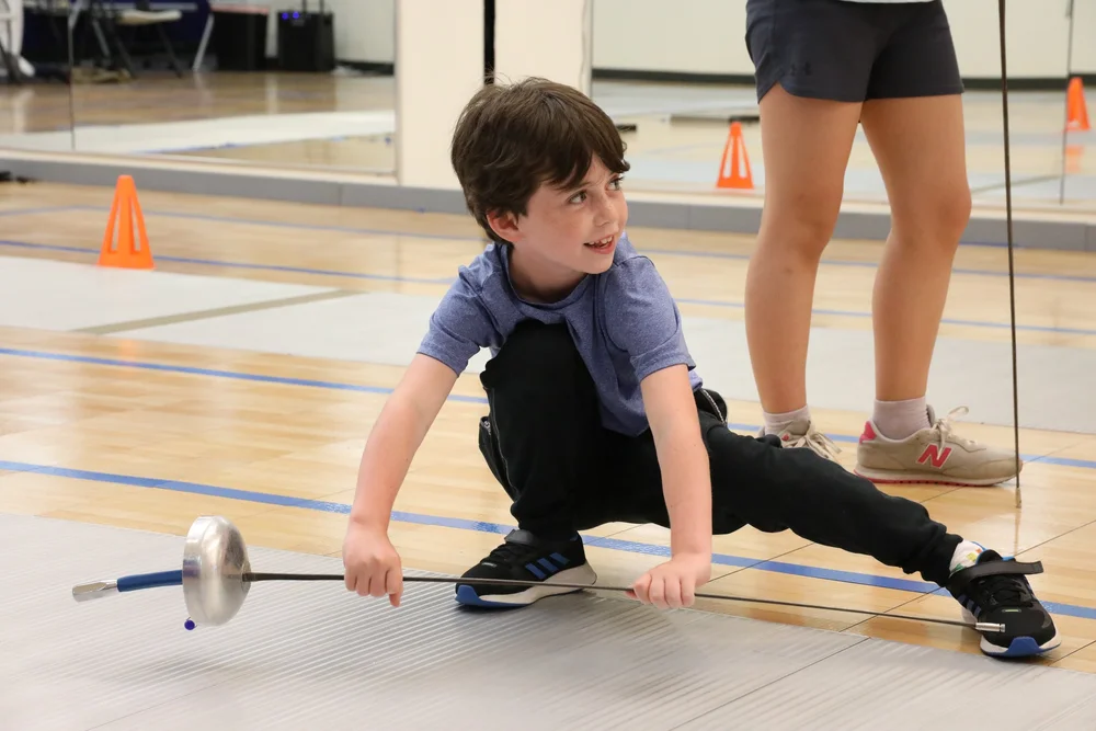 Kids training together at Tim Morehouse Fencing Club summer fencing camp