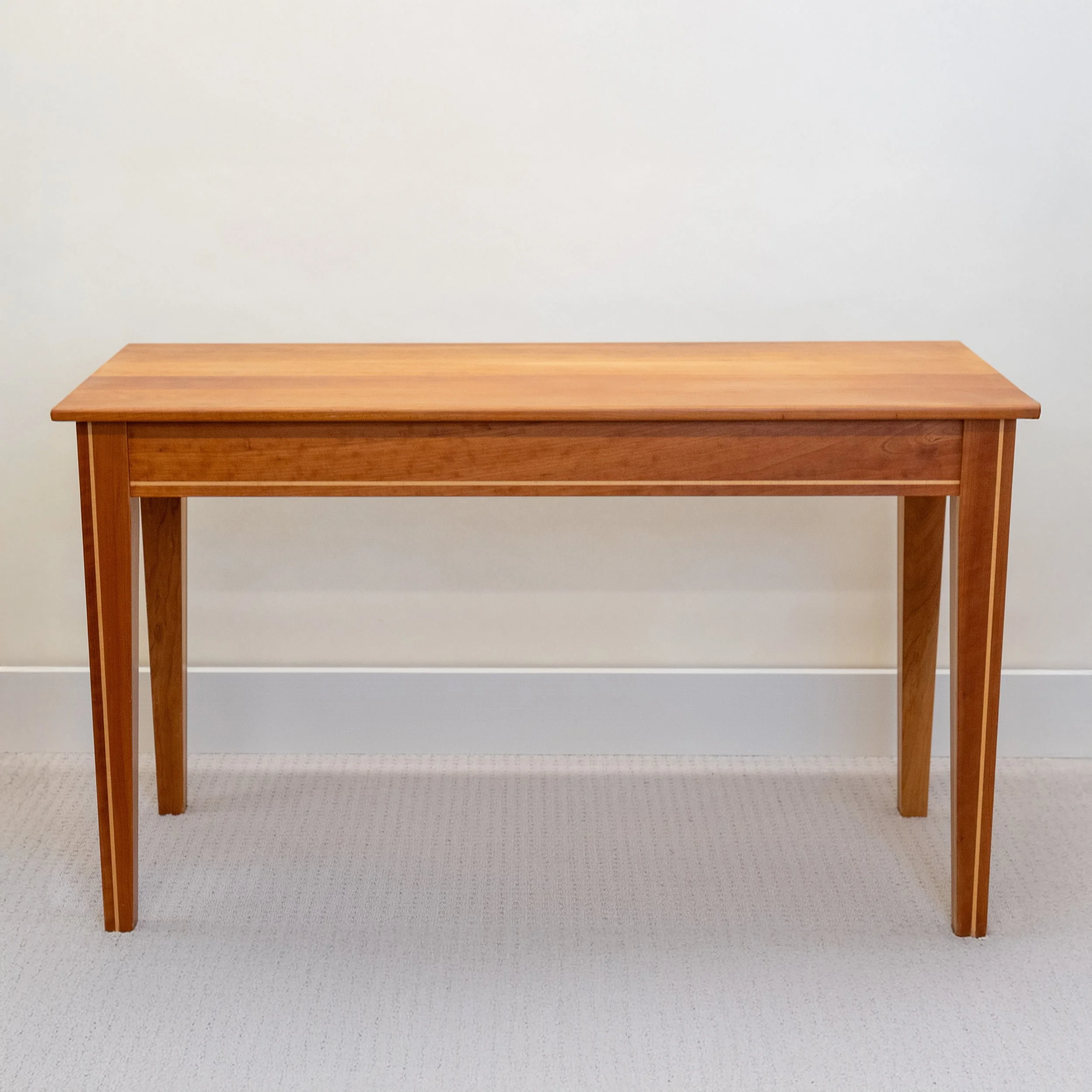 Stratford dressing table, desk, or hall table

20” x 47.5” x 28” high with maple inlay, shown in cherry without drawers

$   920.00 cherry no drawers
$ 1090.00 walnut no drawers