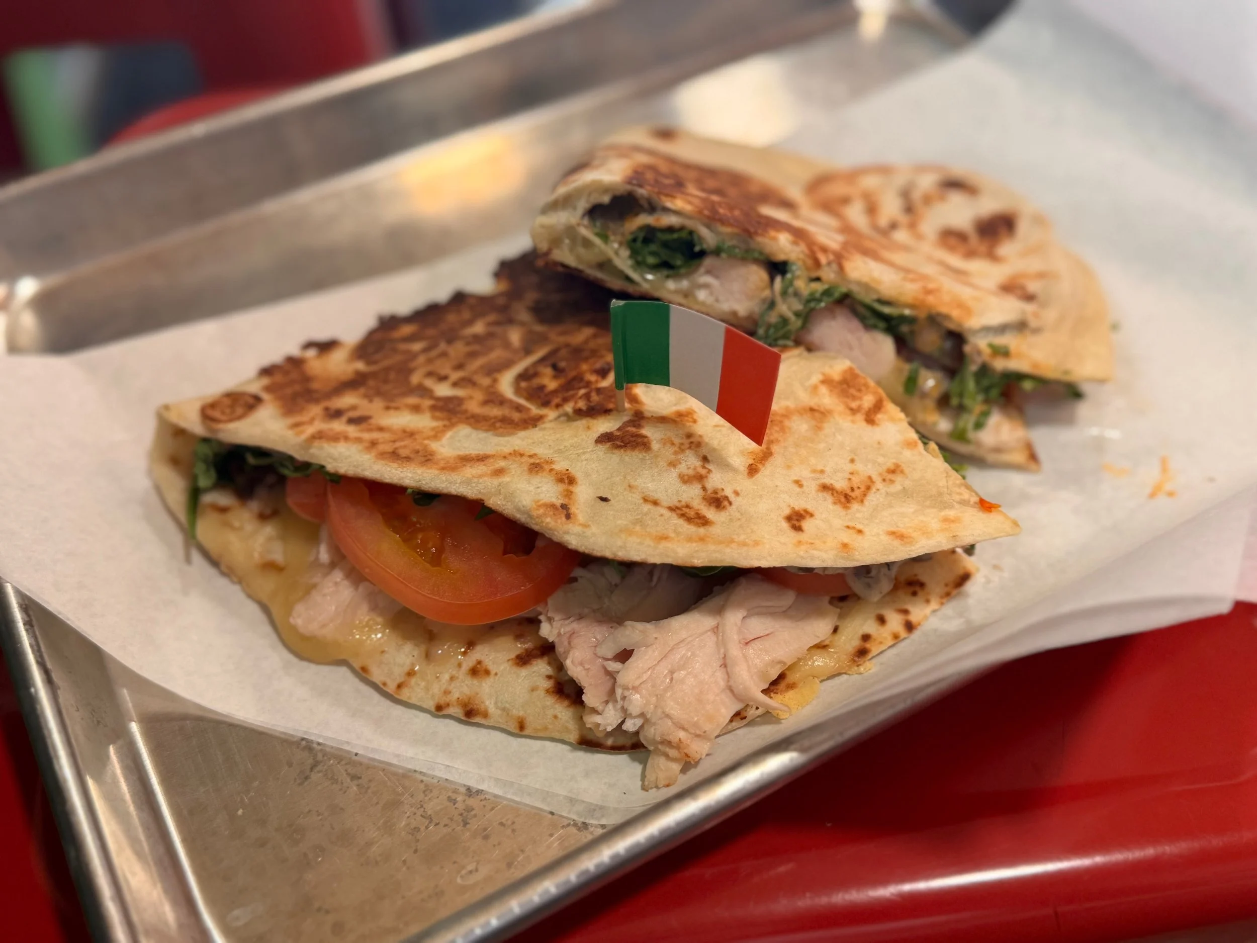 Imported Fontina Cheese, Rotisserie Chicken, Hazel Dell Mushroom Bechamel, tomato, and arugula.