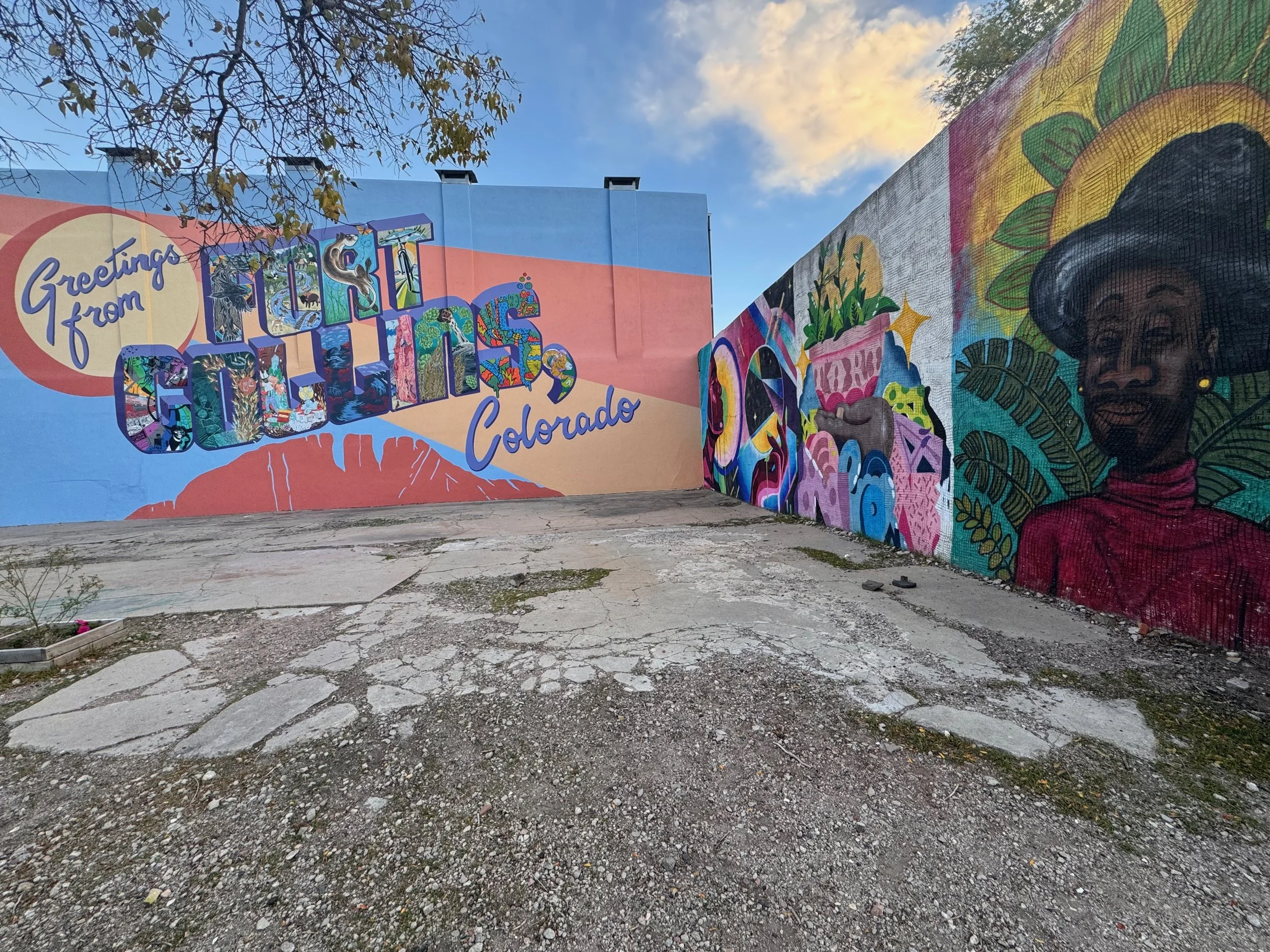 Colorful mural on a wall in Colorado with the words 'Greetings from Fort Collins'