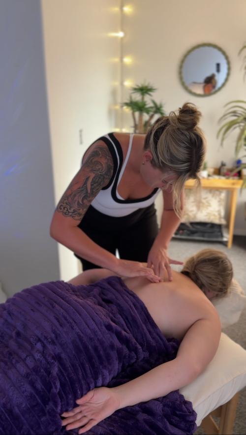 Outdoor bodywork session with practitioner and client