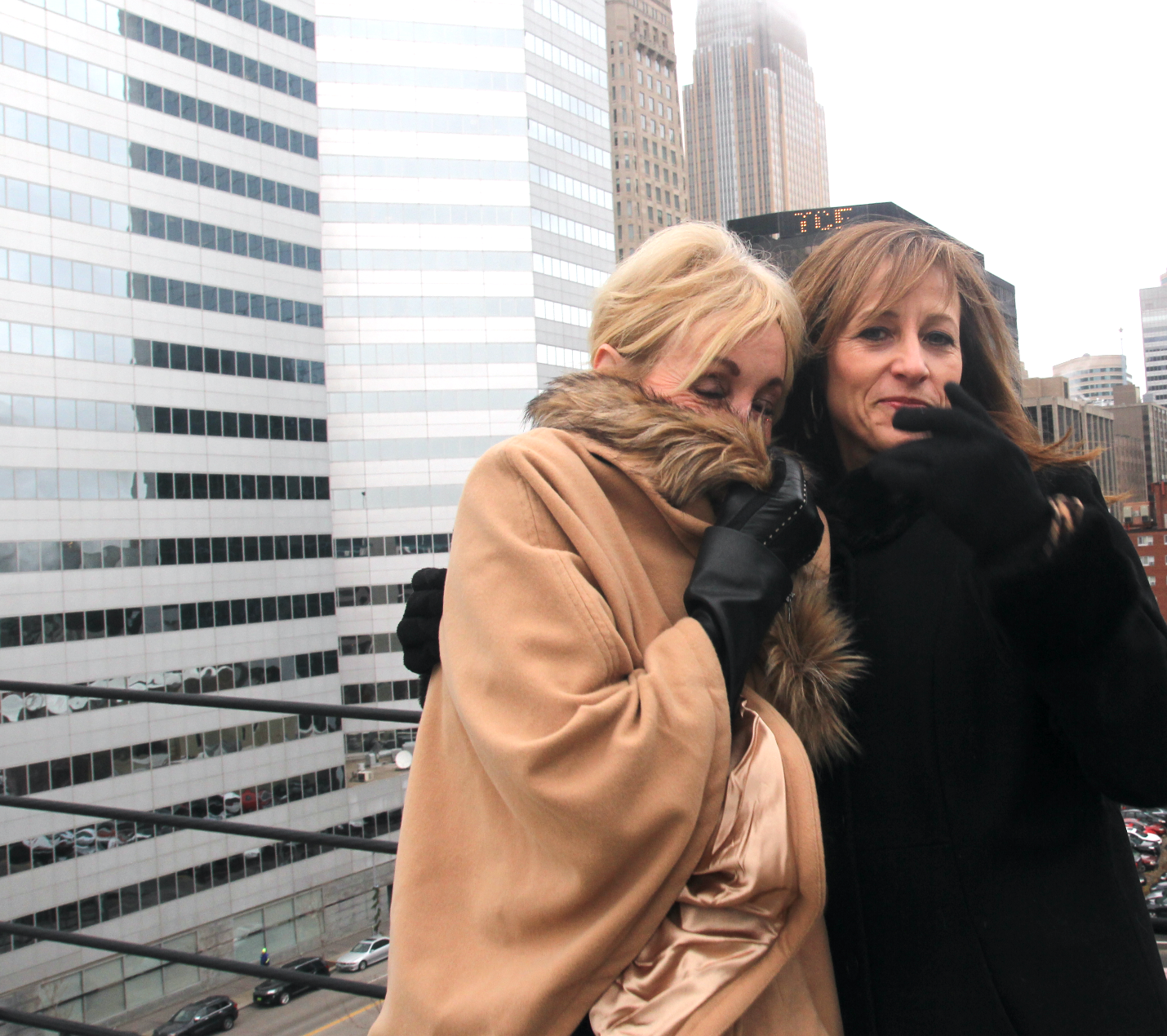 Barbara and Janell with tall buildings around them in downtown Minneapolis