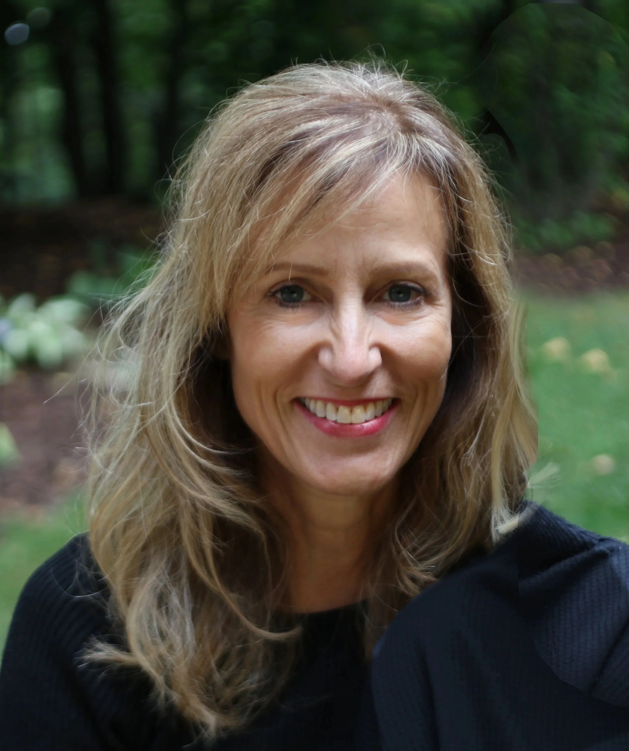 Janell with a beautiful green background